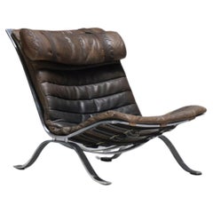 Stunning patinated ARI lounge chair in brown leather by Arne Norell - Möbel AB