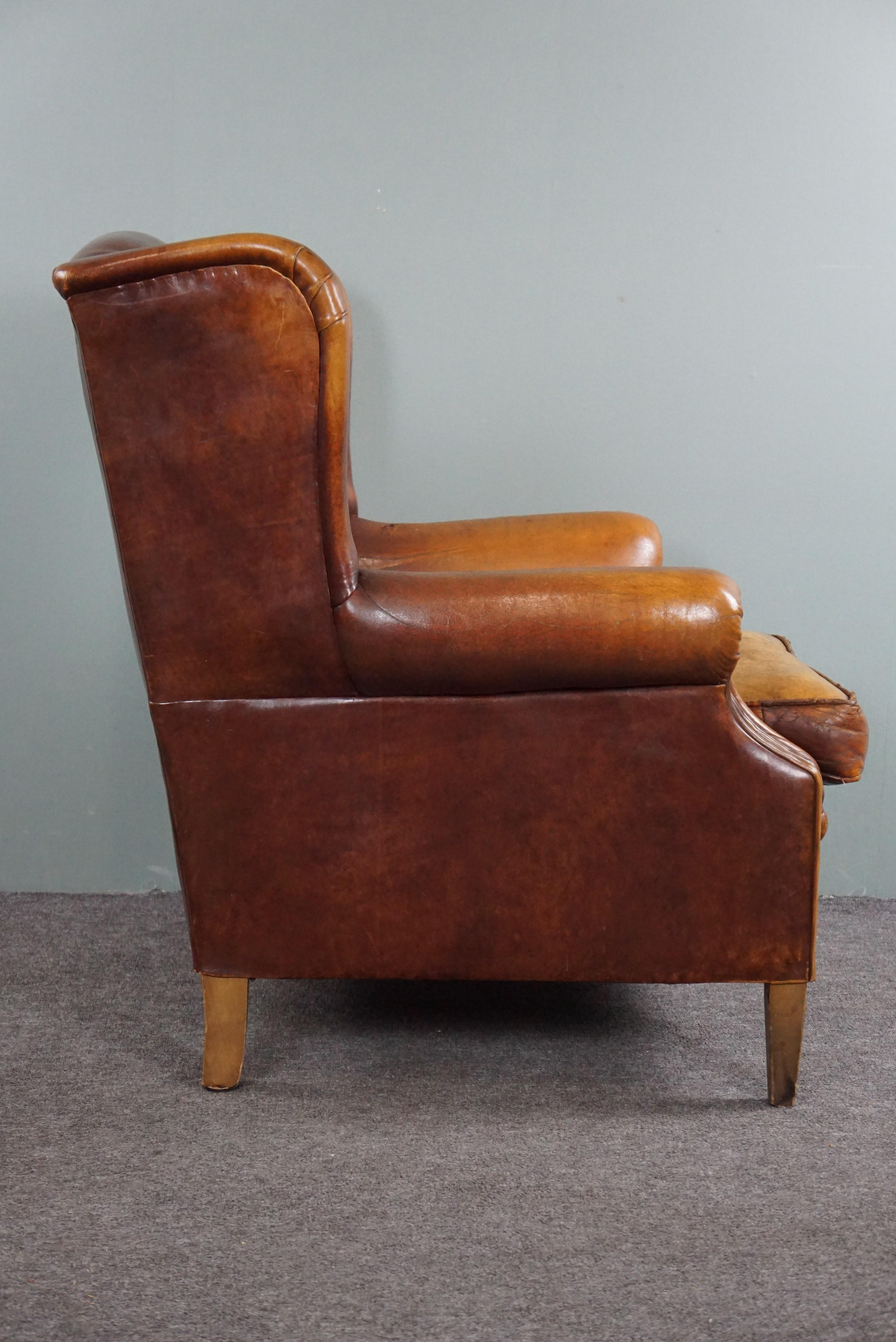 Dutch Stunning patinated sheepskin leather wing chair For Sale