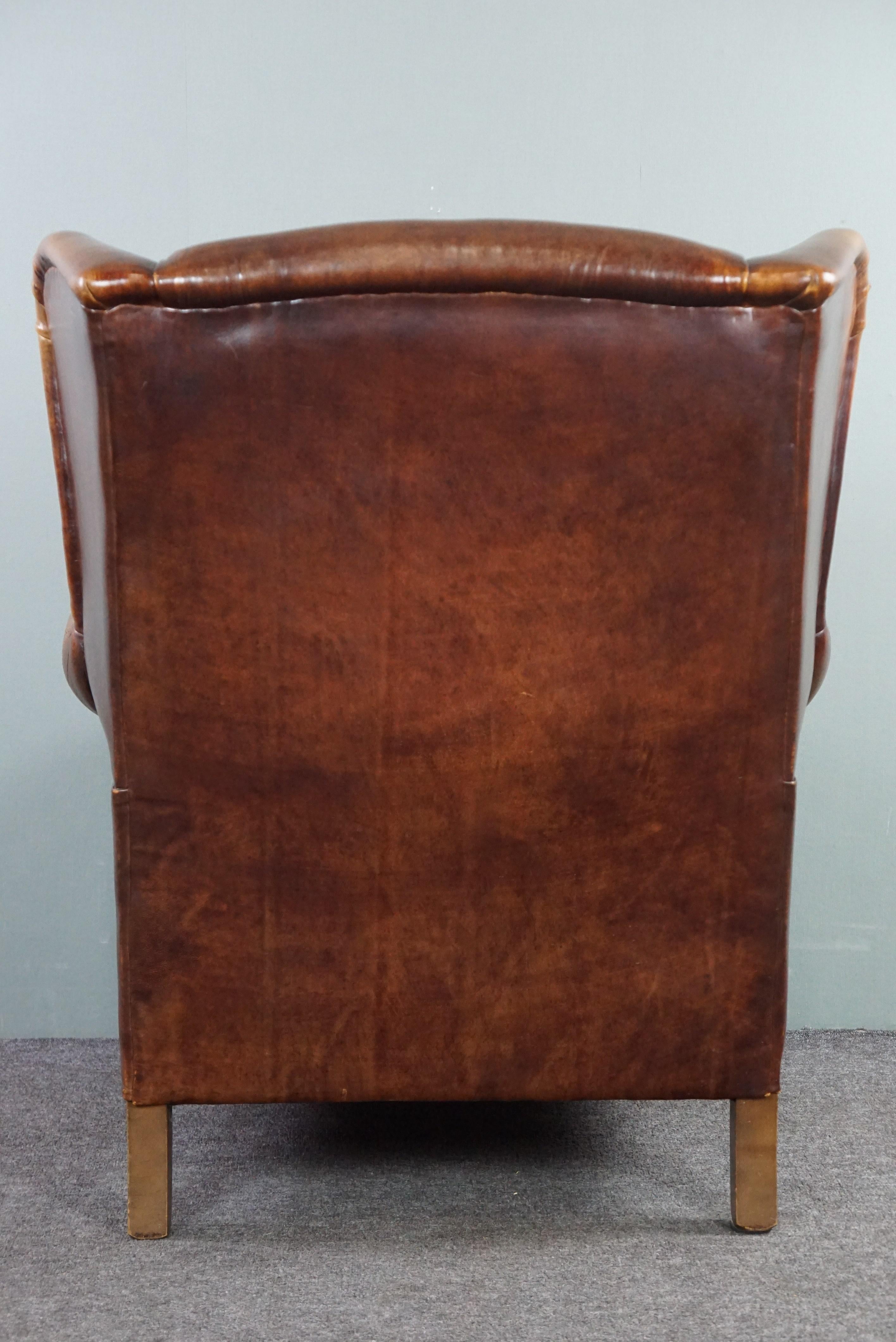 Hand-Crafted Stunning patinated sheepskin leather wing chair For Sale