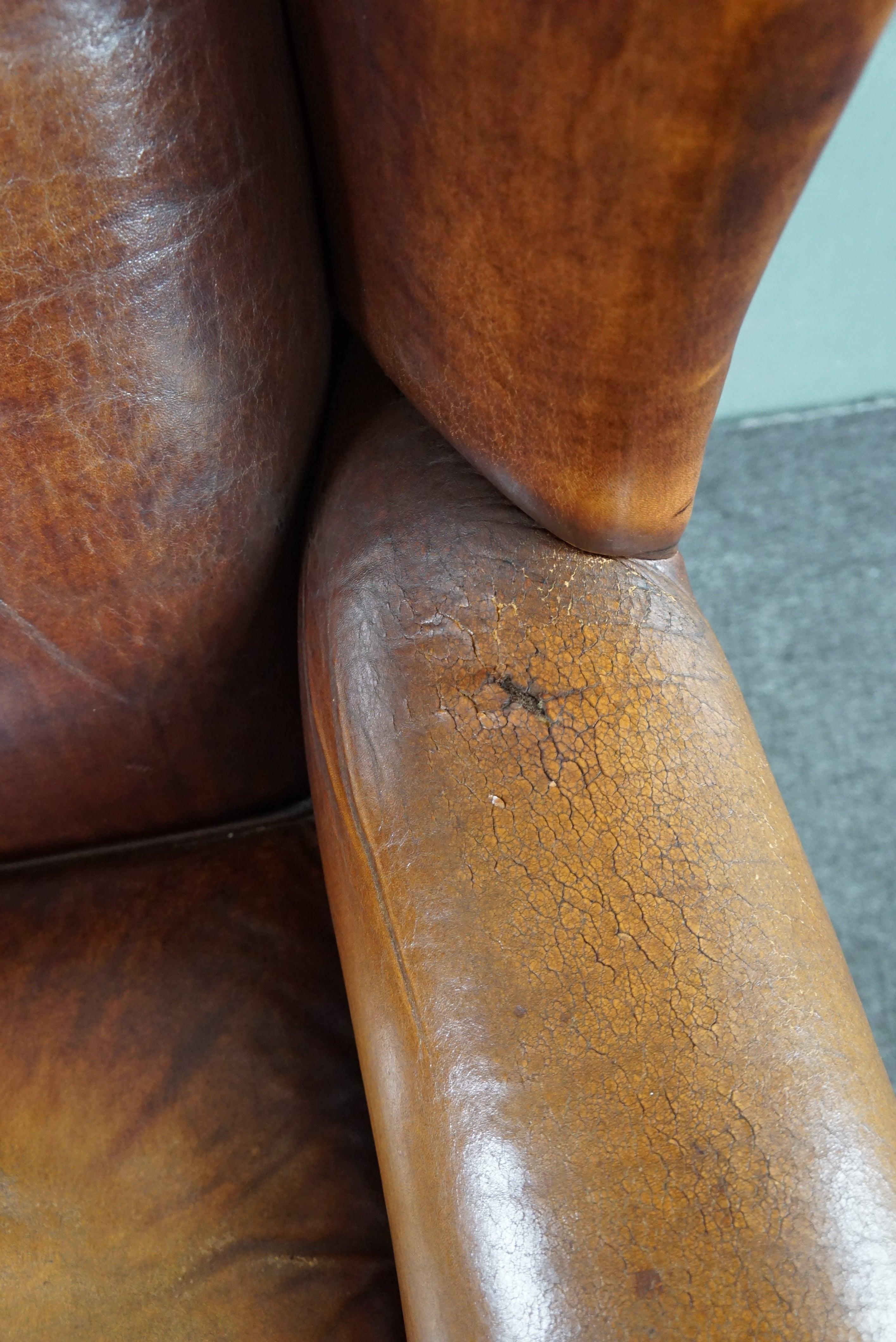 Stunning patinated sheepskin leather wing chair For Sale 2