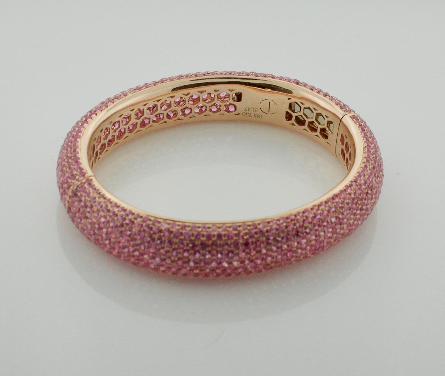 Stunning Pink Sapphire Bangle Bracelet in 18k Rose Gold 31.47 carats
Eight Hundred and Sixty Eight Round Cut Pink Sapphires weighing 31.47 carats.  [bright with no imperfections visible to the naked eye]

Constructed by One of Our Finest Craftsmen. 