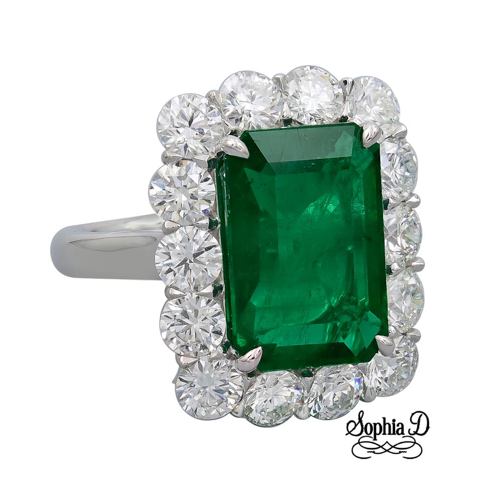 6.75 Carat Emerald and surrounded with 3.24 Carats Diamond Ring in Platinum