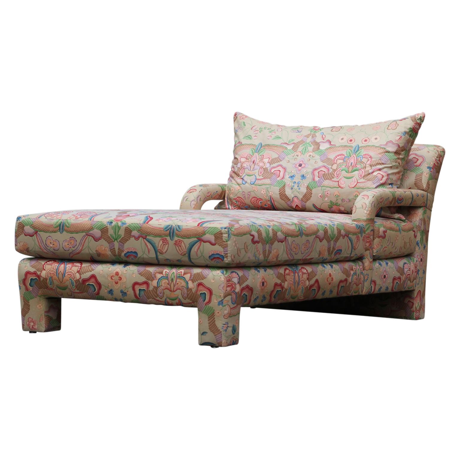 Unique chaise lounge with a large detachable pillow. The lounger is upholstered in a colorful floral fabric. Under the cushion is a John Macheroni and Swaim originals tag. Original fabric is in excellent condition.