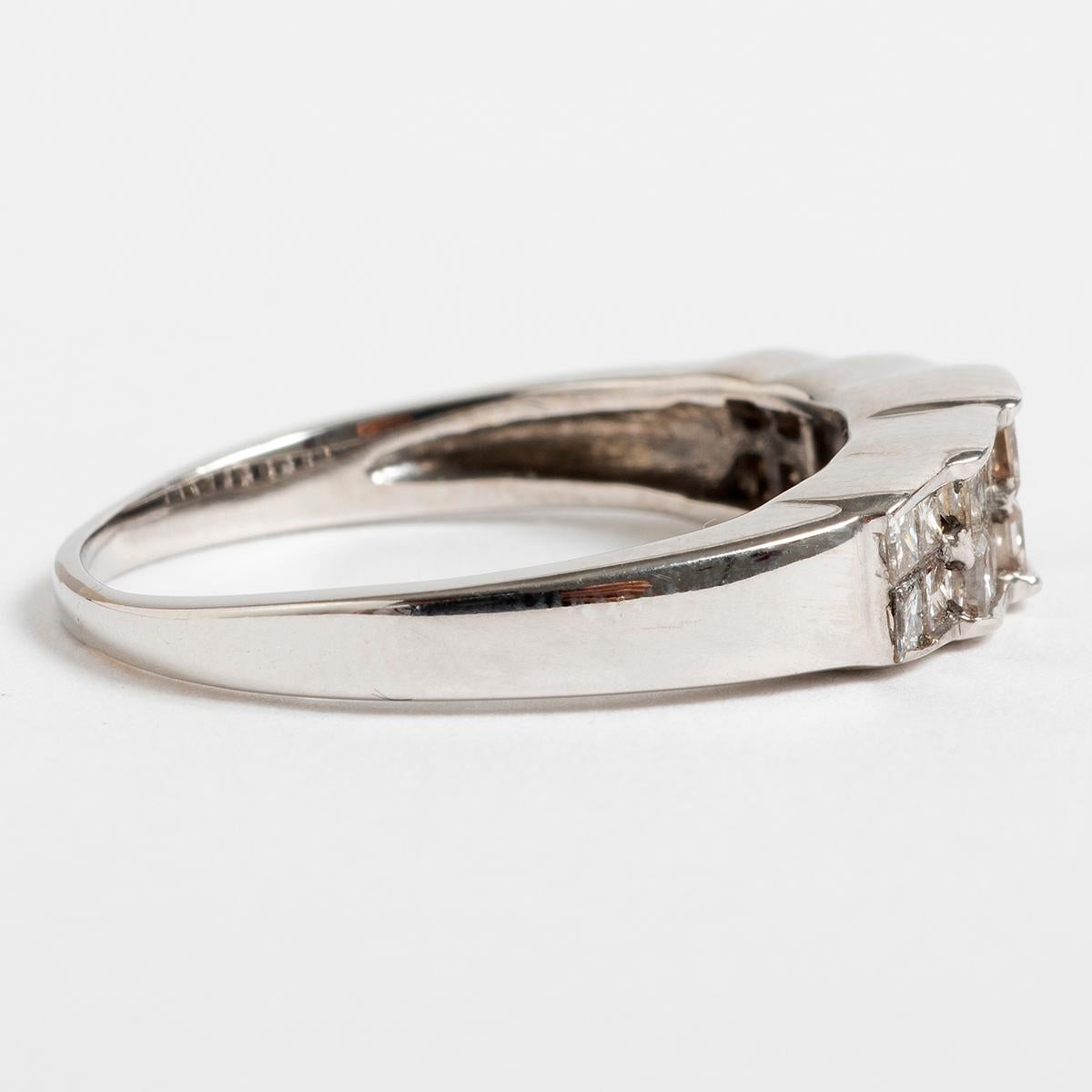 A unique piece within our carefully curated Vintage & Prestige fine jewellery collection, we are delighted to present the following:

This stunning princess diamond set dress ring is set among 14K White Gold and is Est 1.8ct. This ring is UK size R,