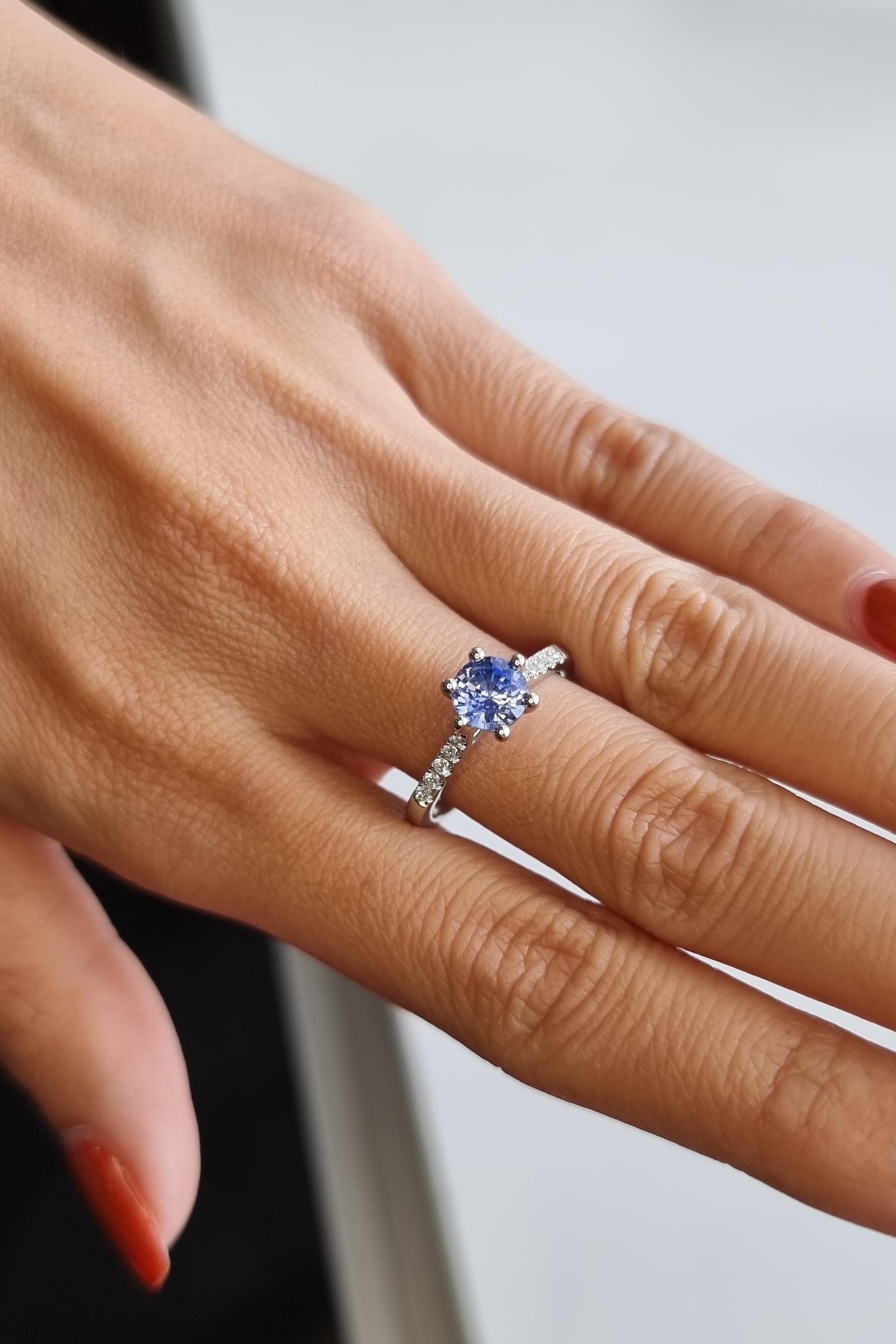 A vision of the sky's crystalline blue, this striking platinum solitaire lets a Ceylon sapphire transport all who behold it into an ethereal realm. Certified by GFCO lab for its prized cornflower hue, the round sapphire dazzles with a saturated