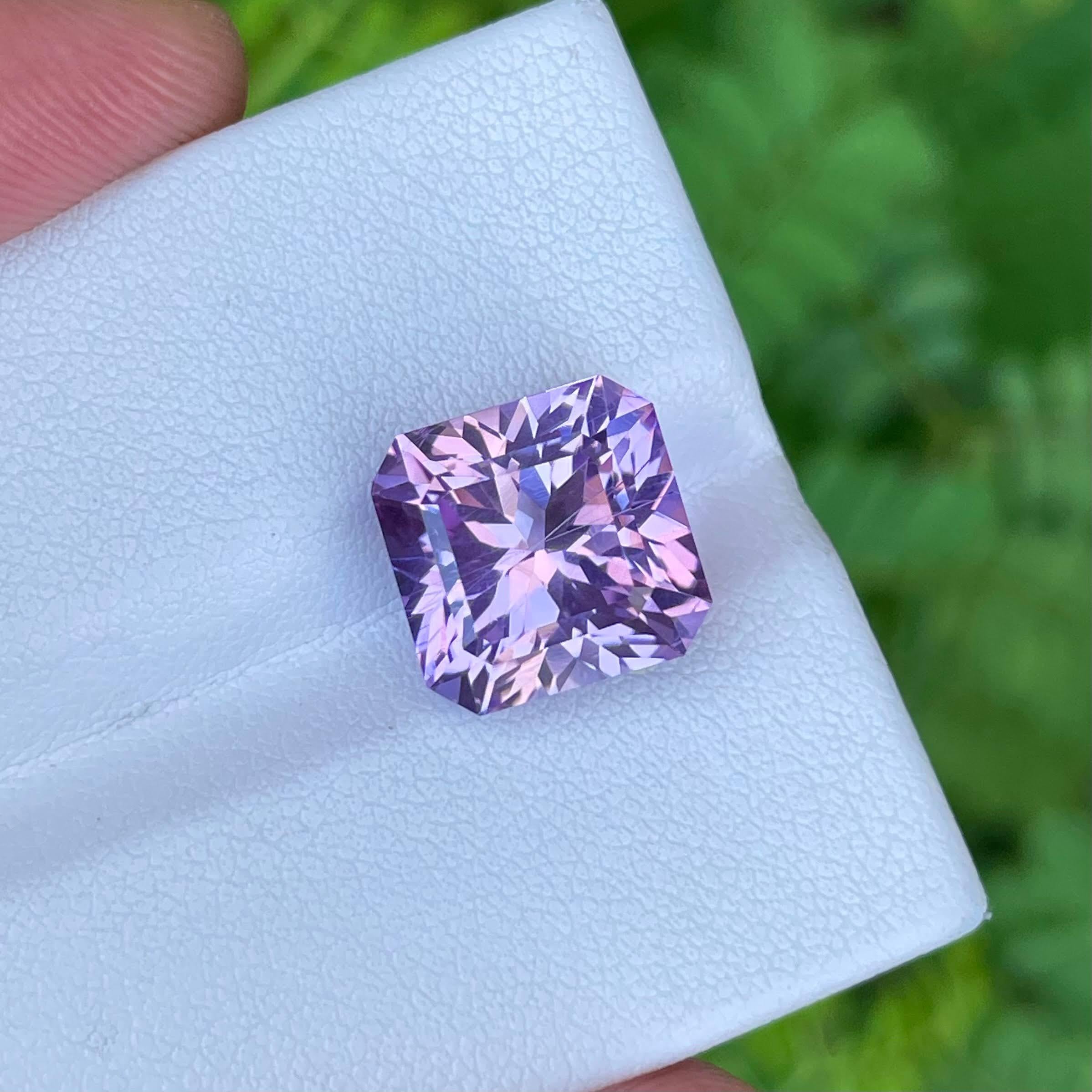 9.30 carats 
11.62x11.42x8.95 mm
Clarity VVS
Treatment None
Origin Nigeria
Shape Octagon
Cut Mix Radiant




In a distant corner of Nigeria, a captivating purple kunzite stone, weighing an impressive 9.30 carats, emerges as a radiant testament to