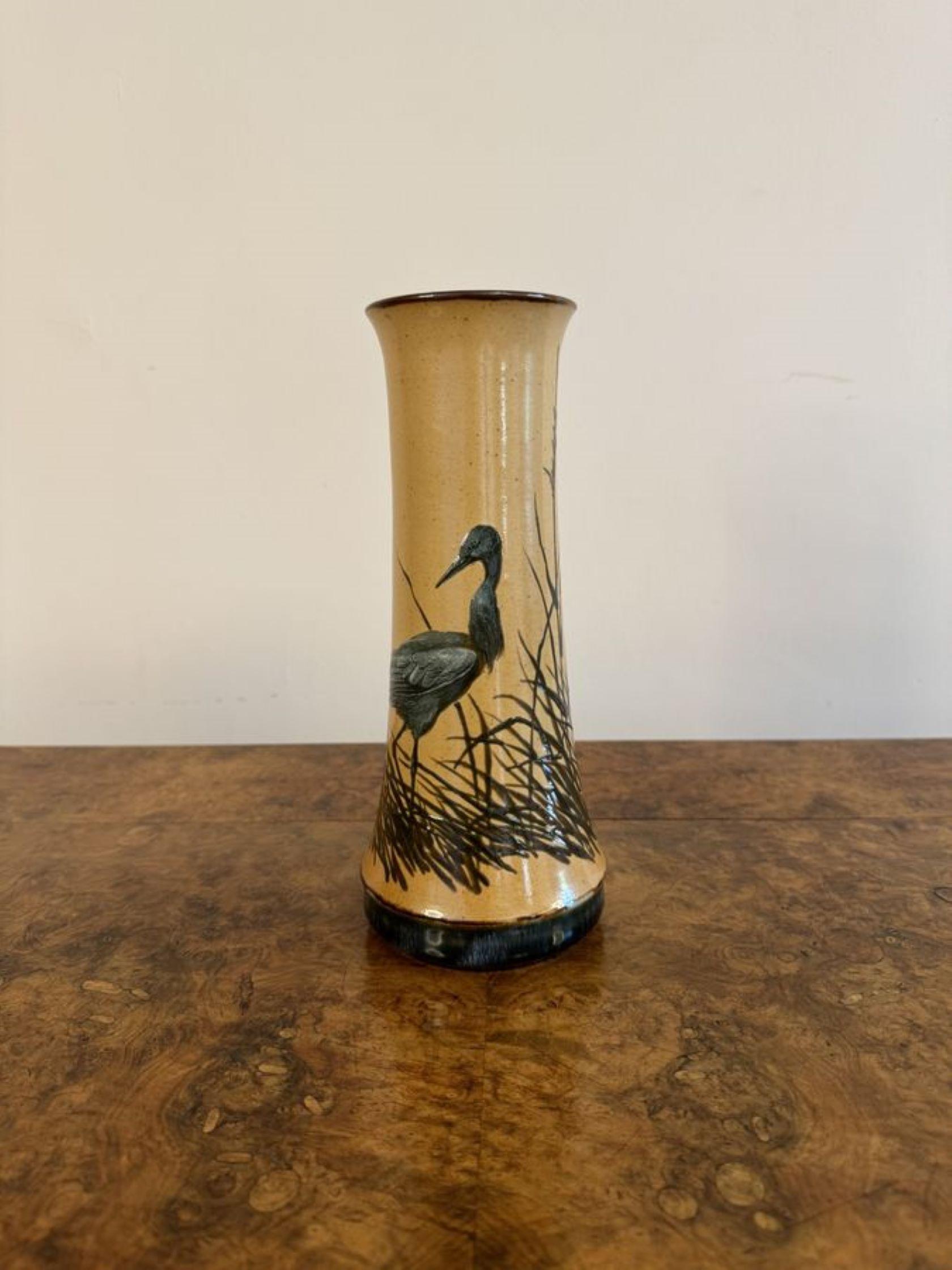 Stunning quality antique Doulton vase by Florence E Barlow, having a quality antique doulton vase by Florence E Barlow with a brown ground decorated with beautiful birds surrounded by grass raised on a circular shaped base.
Stamped and signed to the