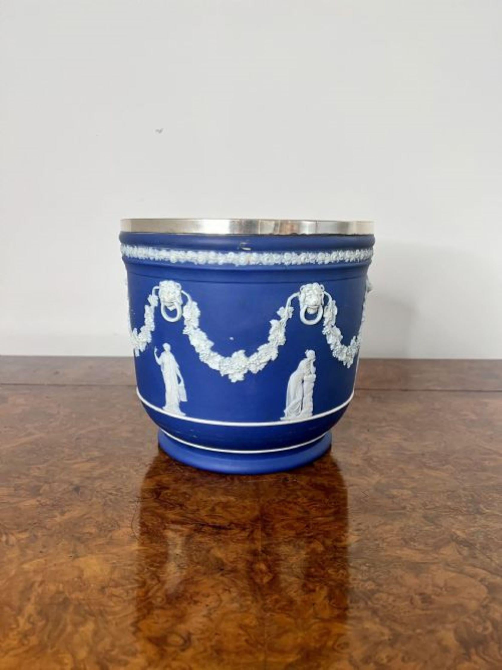 Stunning quality antique Edwardian Wedgwood jardiniere having a stunning quality antique Edwardian Wedgwood jardiniere with a blue ground with white enamel decoration, circular in shape with a silver plated rim.
