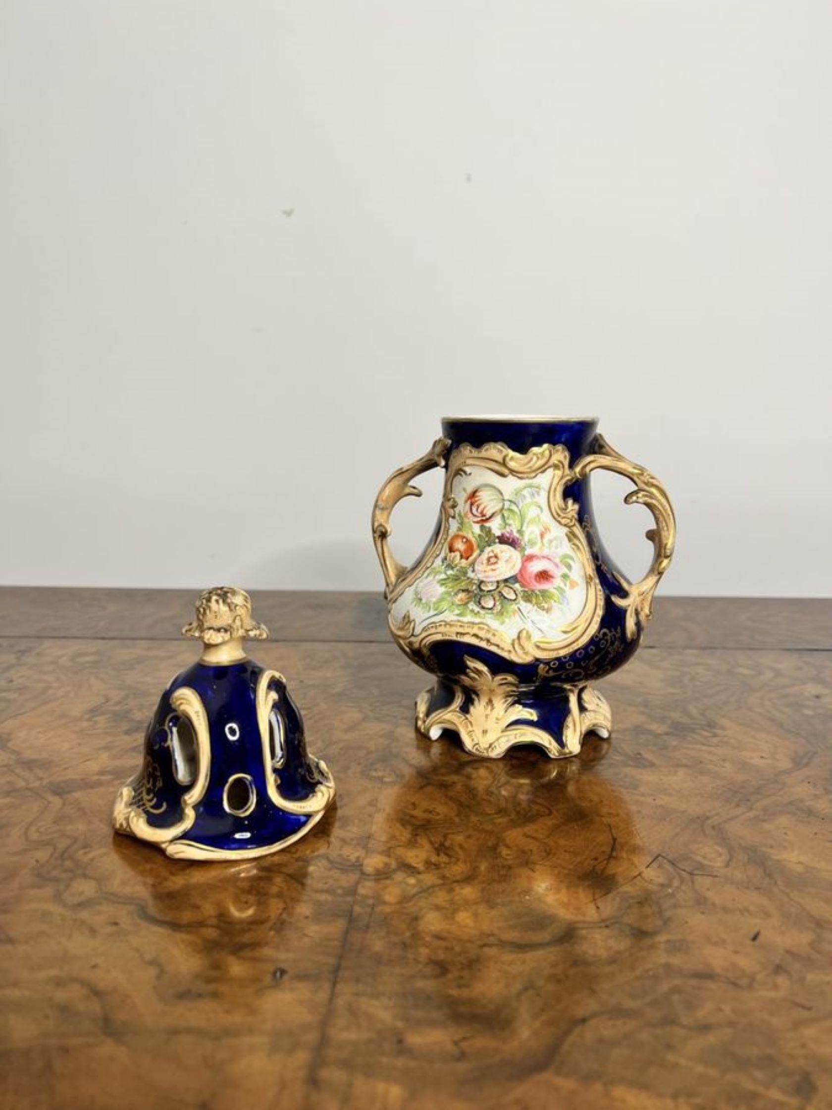 Stunning quality antique Samuel Alcock pot pourri vase and cover, having a blue ground with gold gilding throughout, a wonderful hand painted landscape scene on one side and wonderful flowers on the other, twin detailed handles to the sides, a