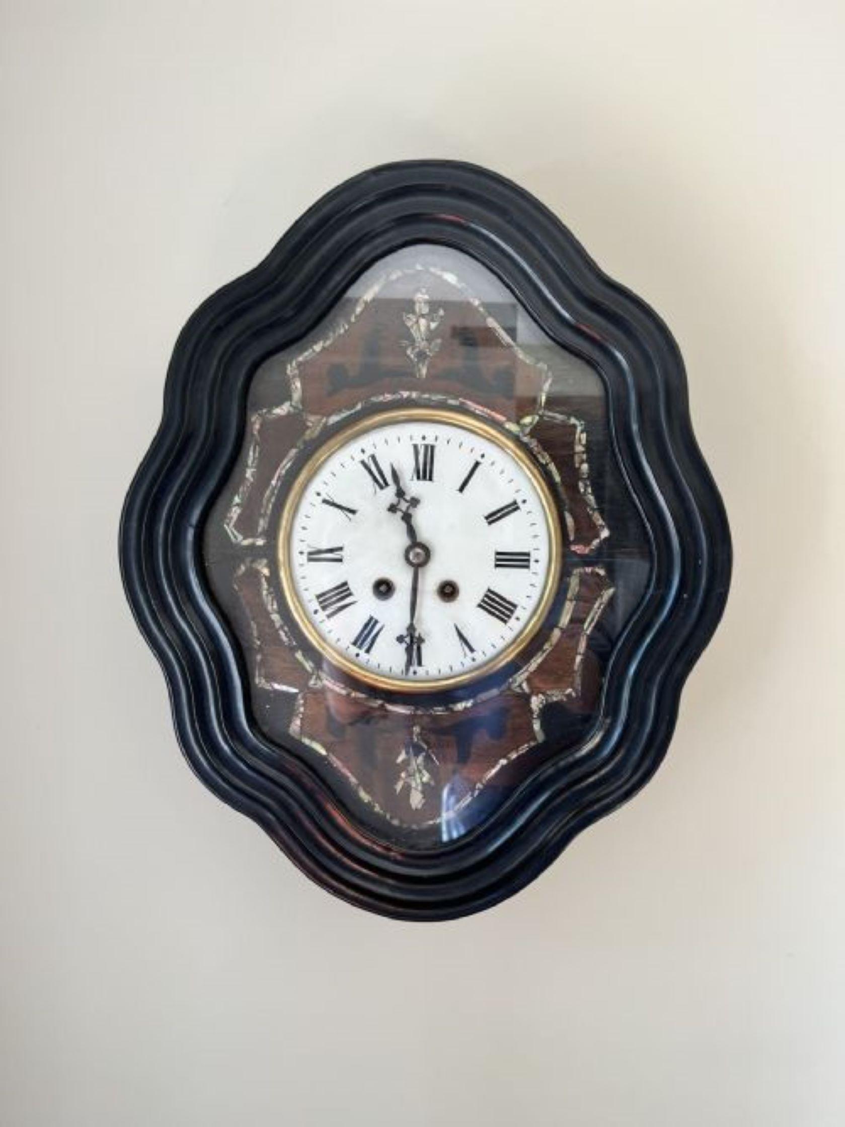 Stunning quality antique Victorian French wall clock in an attractive shaped case having fantastic inlaid decorated, circular porcelain dial with the original hands, eight day movement striking the hour and half hour on a gong. 
Please note all of