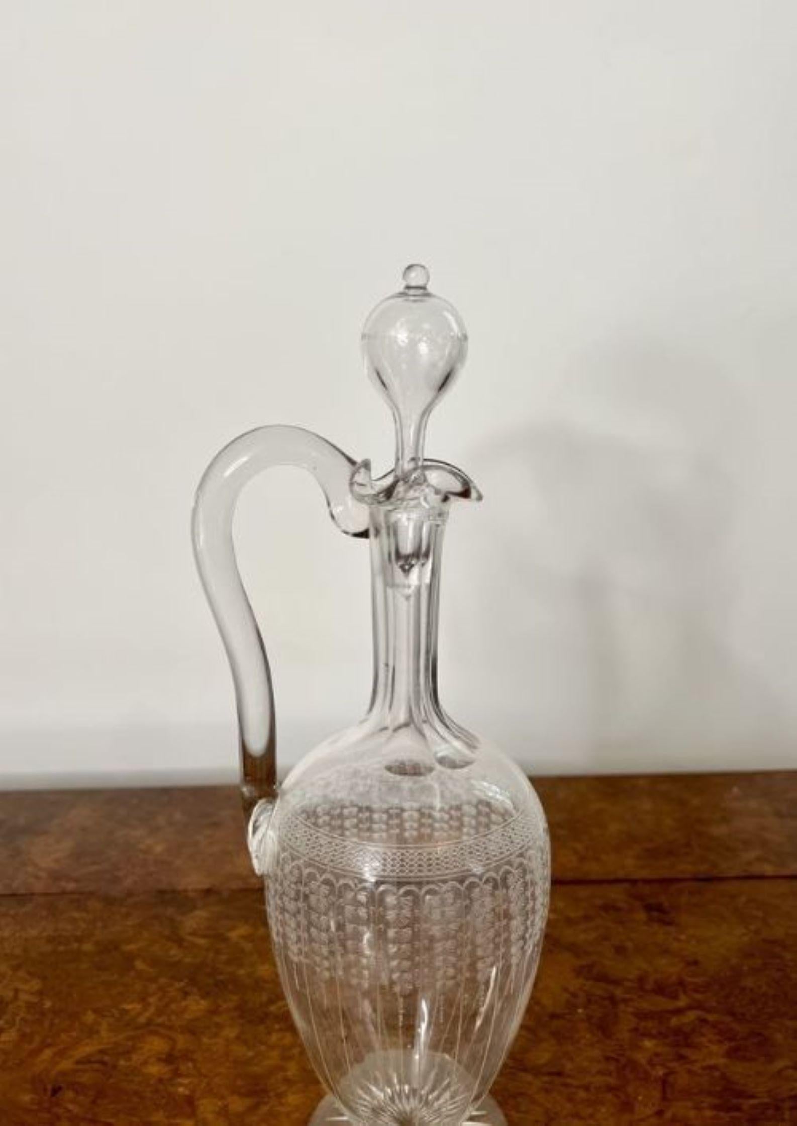 Stunning quality antique Victorian glass decanter having a fantastic quality antique Victorian glass decanter with a wavy top, a shaped handle to the back and the original glass stopper.