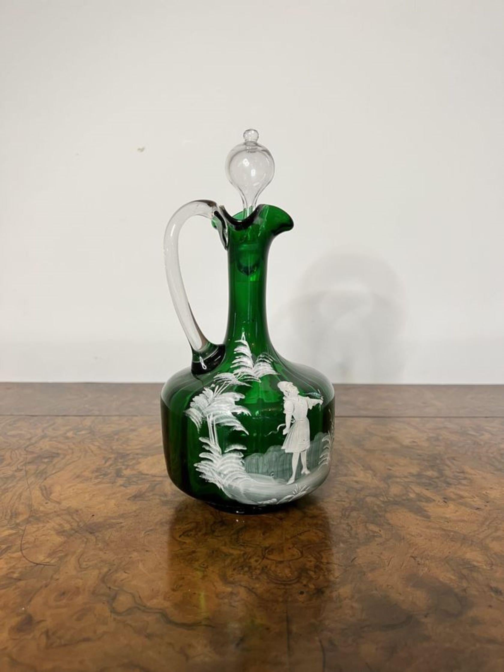 Stunning quality antique Victorian Mary Gregory green glass ewer having a stunning quality Mary Gregory green glass ewer with white enamel decoration of a girl surrounded by trees having a shaped handle to the back and a wavy top with the original