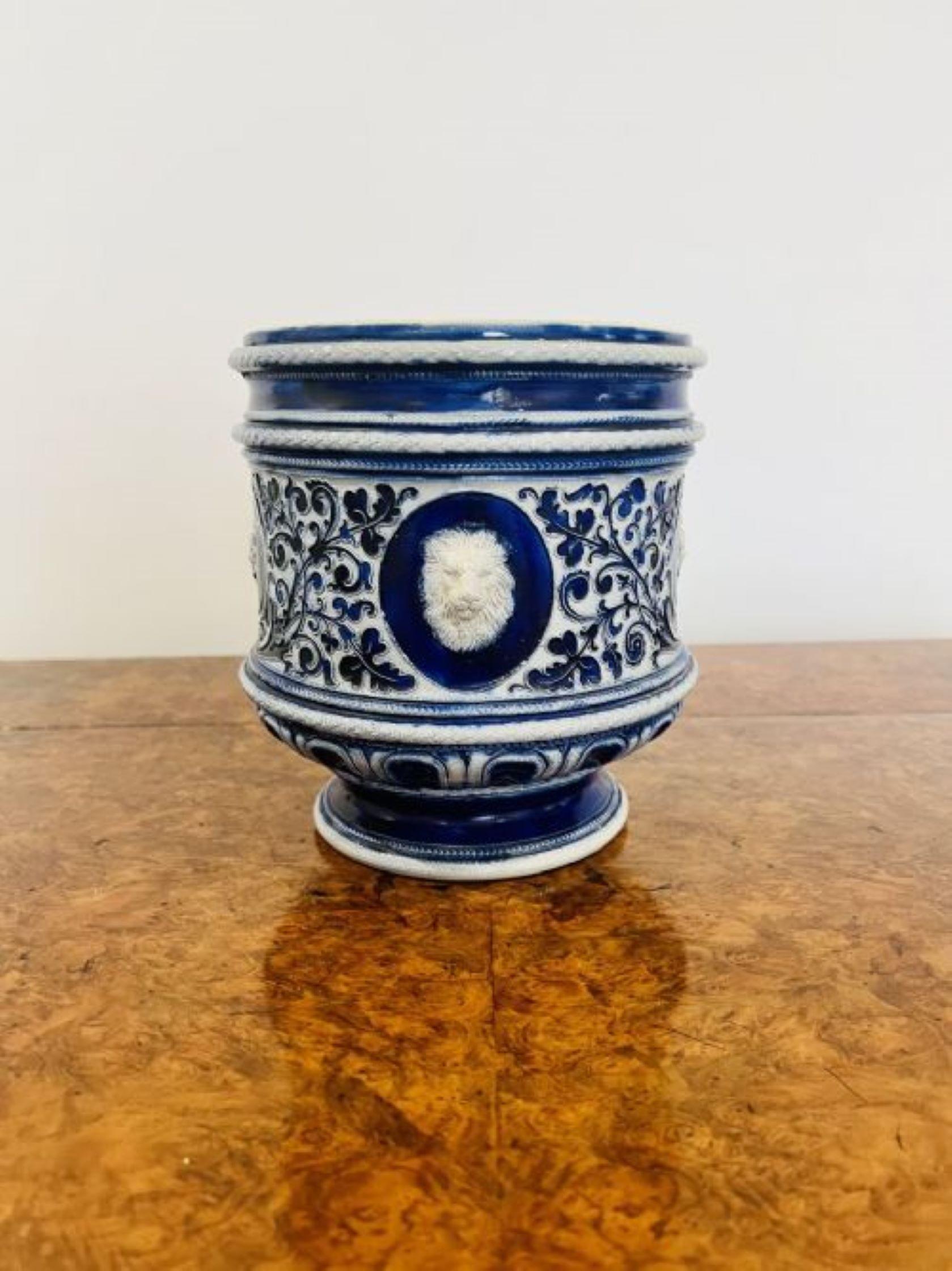 Stunning quality antique Victorian salt glazed German jardiniere having a quality antique German slat glazed jardiniere in blue and white colours decorated with masks and vines. 