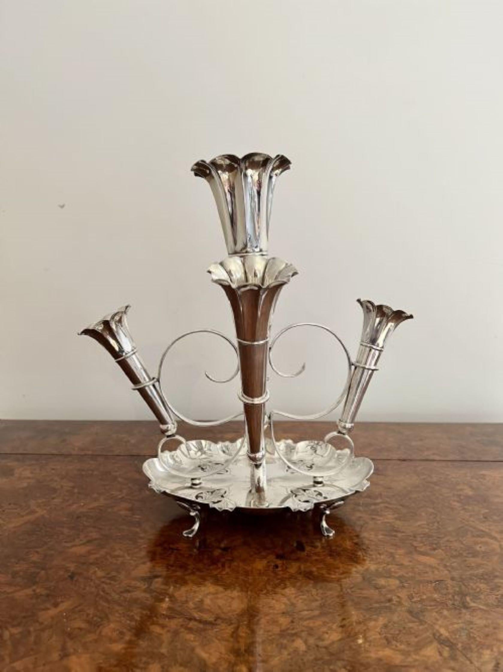 Stunning quality antique Victorian silver plated five branch epergne having a stunning quality antique Victorian silver plated epergne with a large central tapering vase surrounded by four smaller vases on a wonderful ornate silver plated base