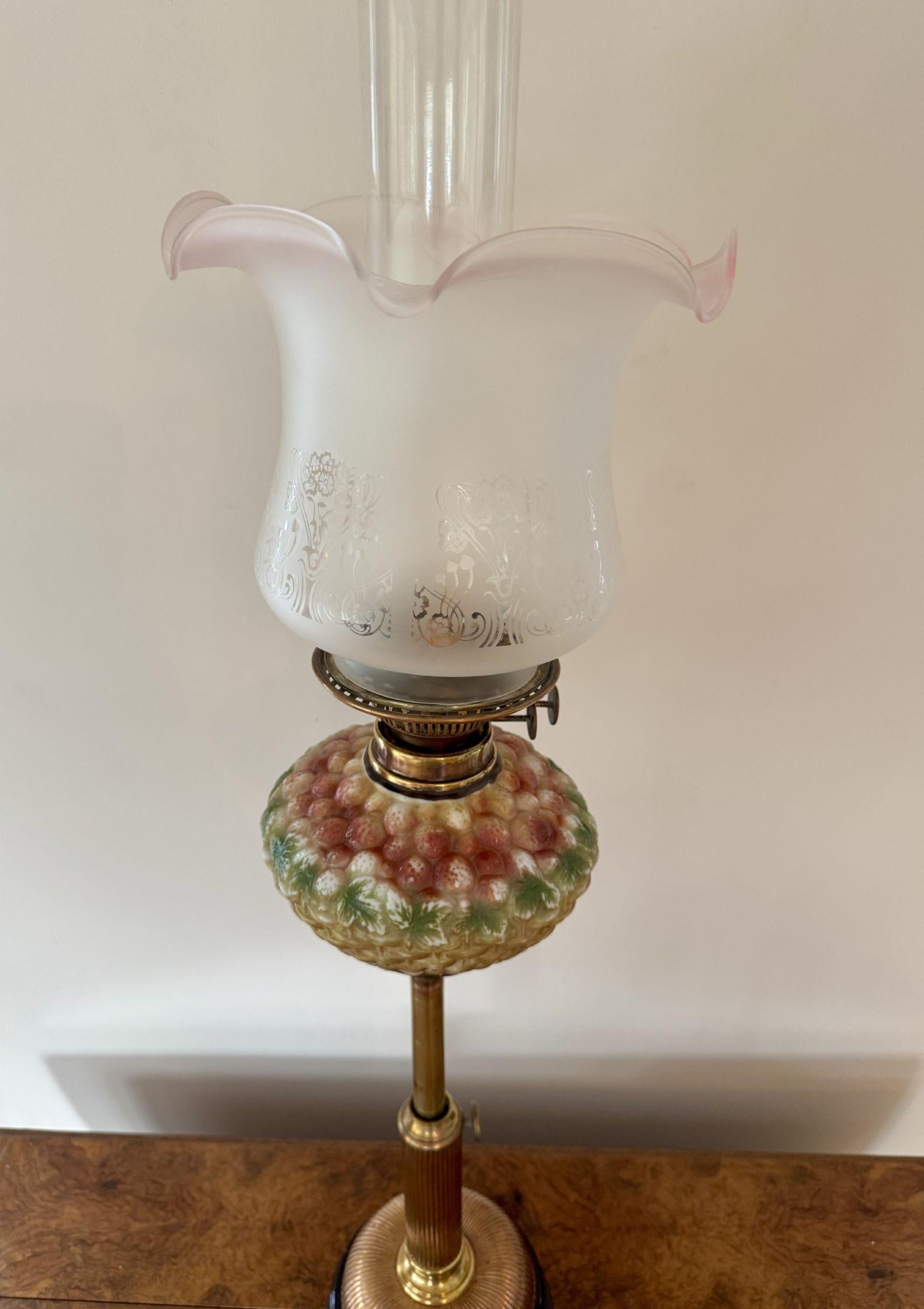 Stunning quality antique Victorian telescopic oil lamp, having a cranberry tinted acid etched glass shade above a brass burner, with a moulded glass basket of fruit font in beautiful red, white, green and brown colours above a telescopic brass and