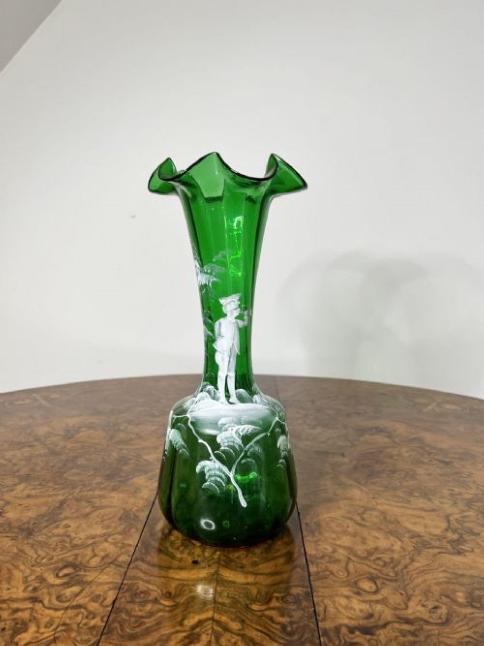 Stunning quality pair of antique Victorian Mary Gregory vases having a quality pair of Mary Gregory green glass vases having quality wavy shaped tops, decorated with white enamel decoration of a boy playing an instrument surrounded by trees and