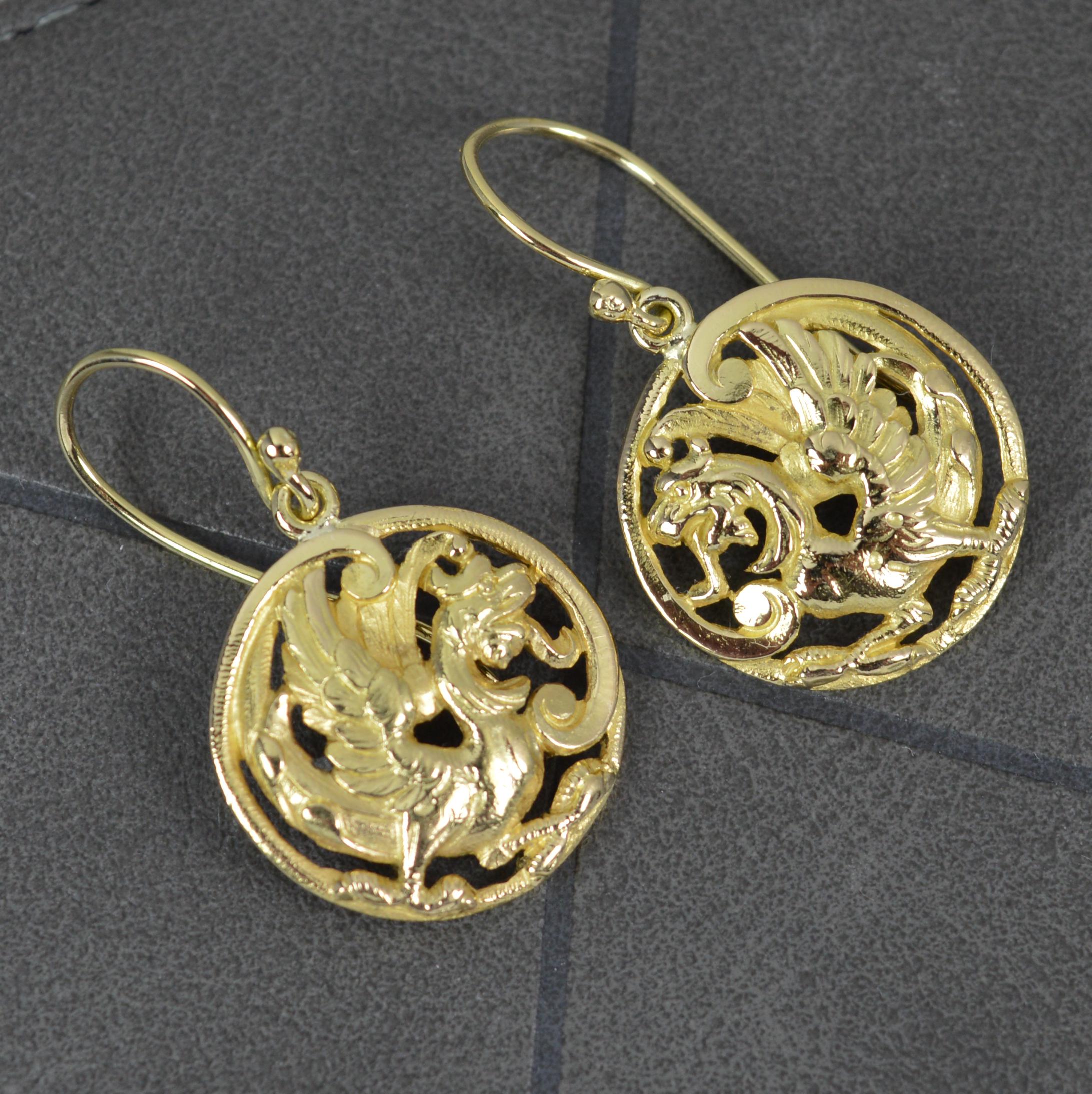 A stunning pair of antique earrings, late Victorian c1880.
Solid 18 carat yellow gold disc panels and hook backs.
The pierced circular discs are pierced with a phoenix / griffin type creature facing one another.

CONDITION ; Very good for age. Clean