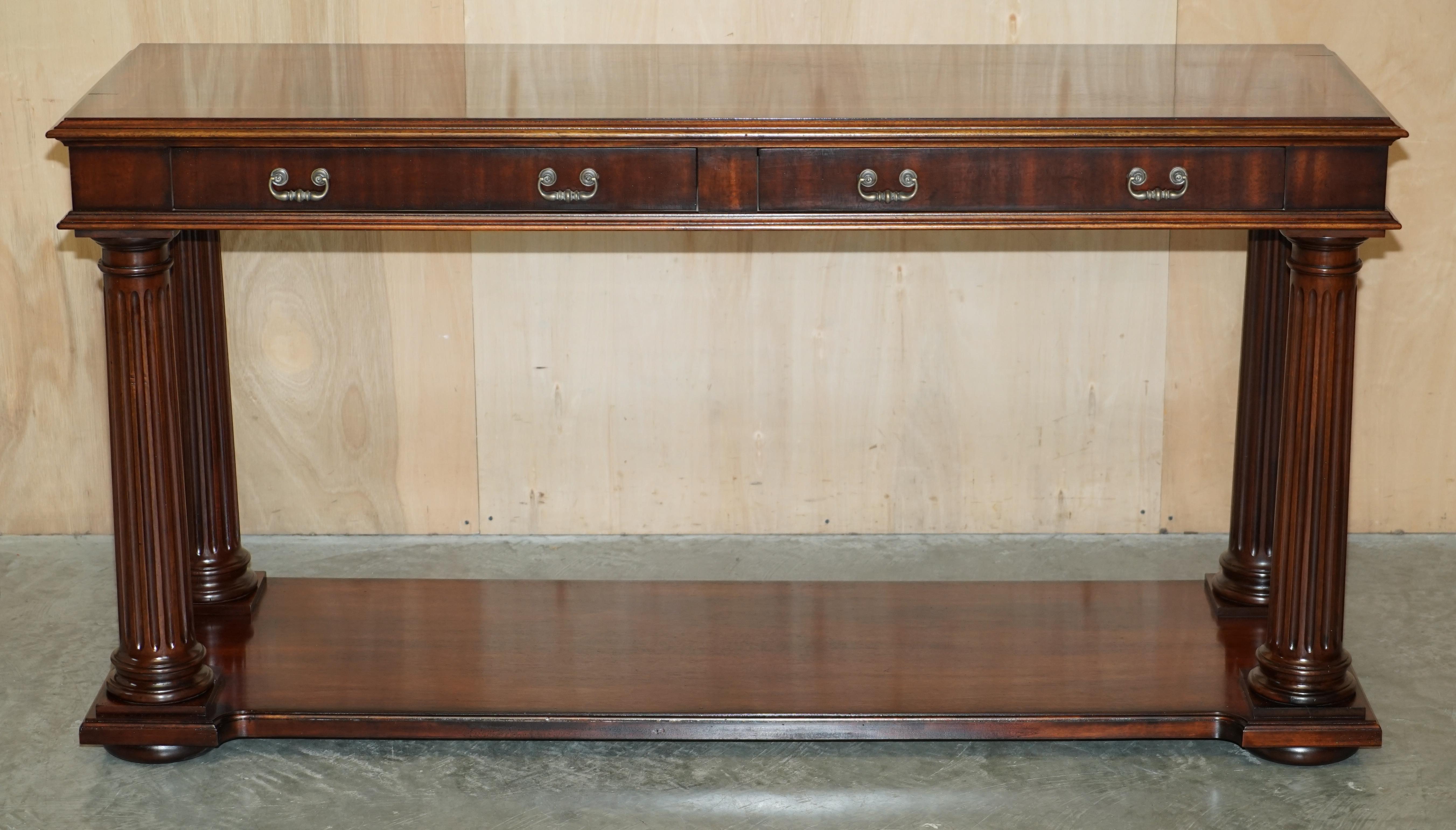 We are delighted to offer for sale this stunning, extra large Ralph Lauren, American Mahogany, two drawer console table with Corinthian pillar legs 

This piece is in sublime condition, it has been used for a show home only and looks to be in