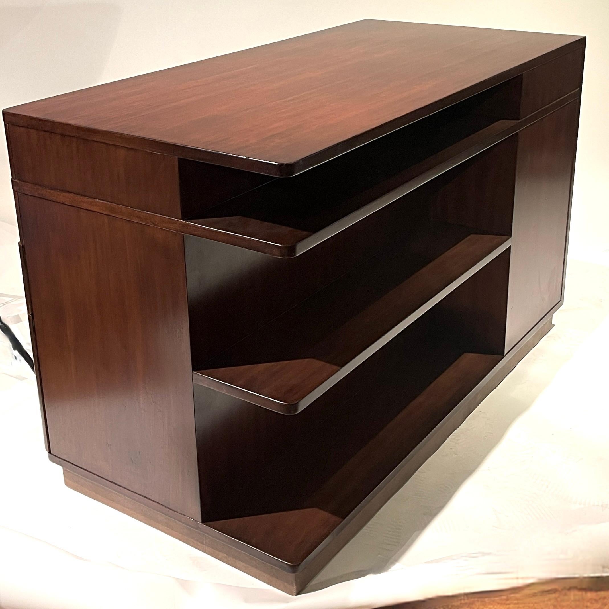 Expertly restored mahogany desk designed by Edward Wormley for Dunbar. Stamp present on underside of top drawer. Mahogany construction with leather wrapped base. Absolutely stunning in person.