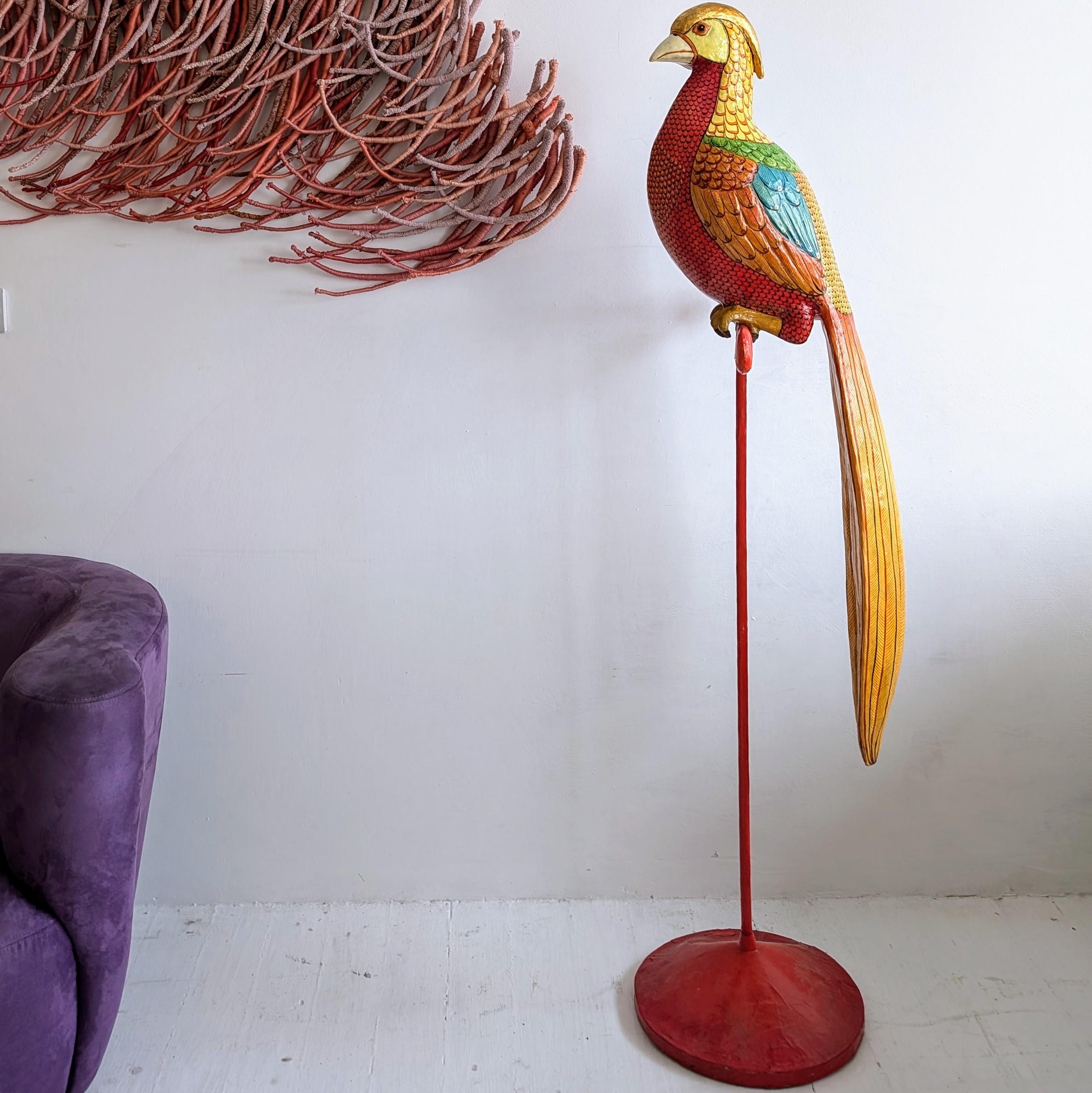 A large, rare floorstanding papier-mache Golden Pheasant sculpture on his original red perch, by acclaimed Mexican artist Sergio Bustamante. The colours and execution are exquisite, with relief to the feathered areas and gilding on the head. Dating