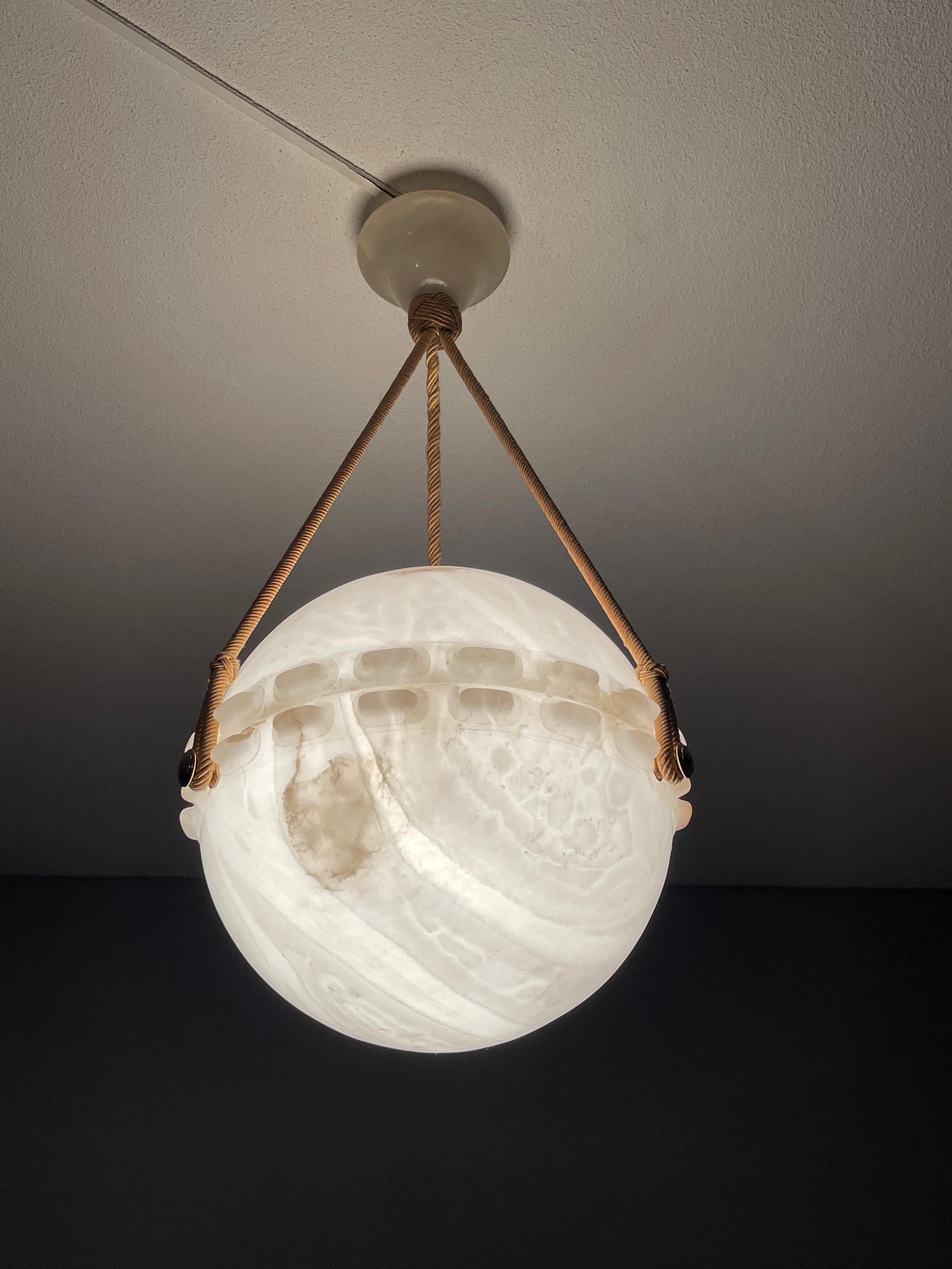 Aesthetically perfect and rare Art Deco alabaster and rope chandelier.

In recent years we have become known for offering the rarest and most beautiful alabaster pendant lights that your well earned money can buy. This stunning, two-piece,