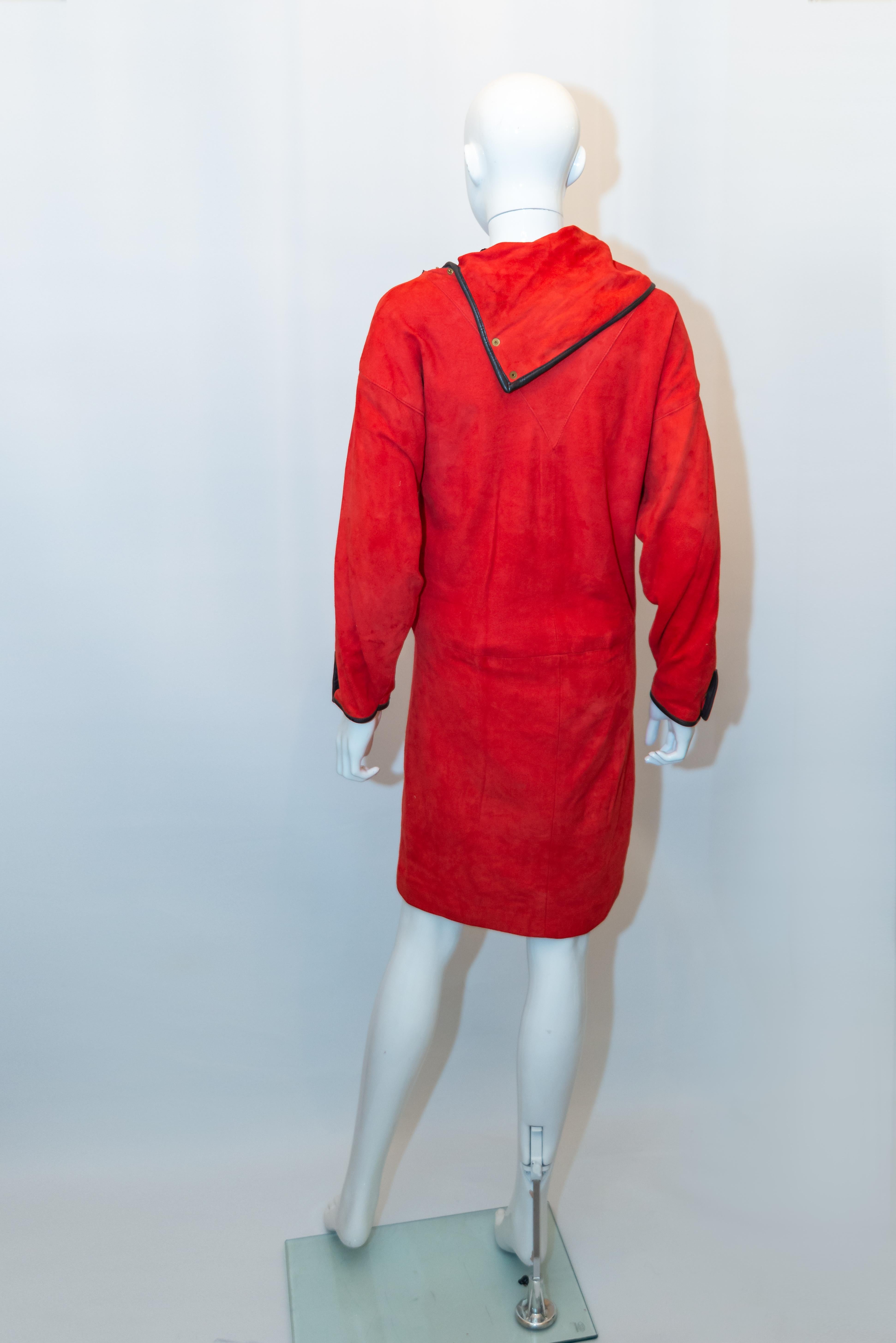 A stunning and elegant red suede dress by Feleicia? The dress has a brown leather trim with a popper fastening collar on one side. It is fully lined. 
Bust up to 38'', length 27''