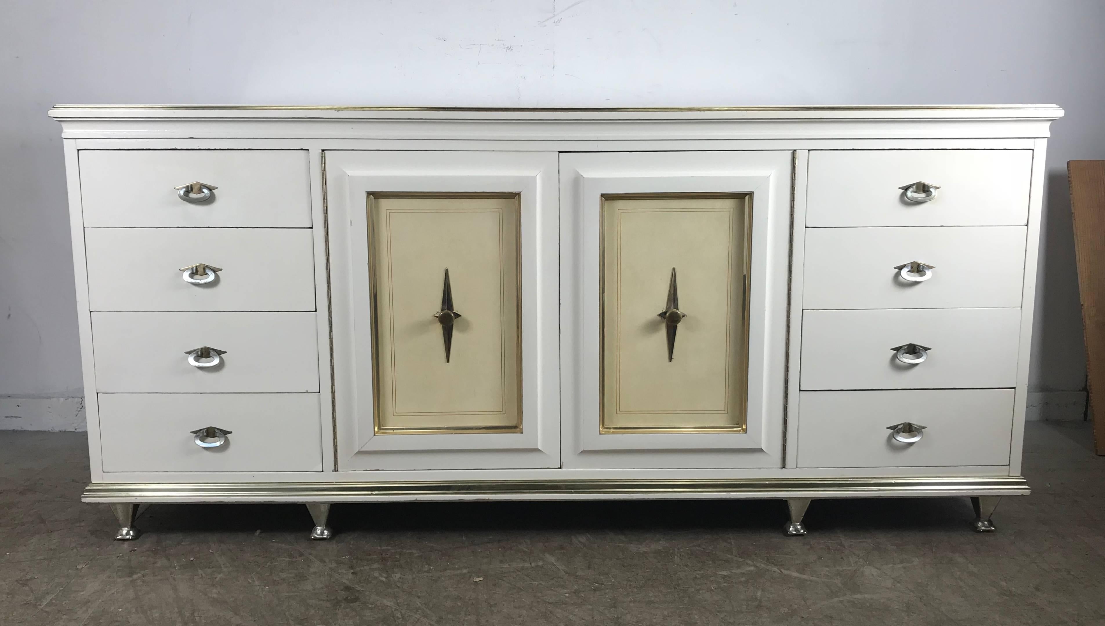 An absolutely stunning chest/dresser from a rare series by American of Martinsville, circa 1960. Beautiful, stout hardwood case construction, with brass and leather accents. Fabulous detail and craftsmanship. The A of M designers were always