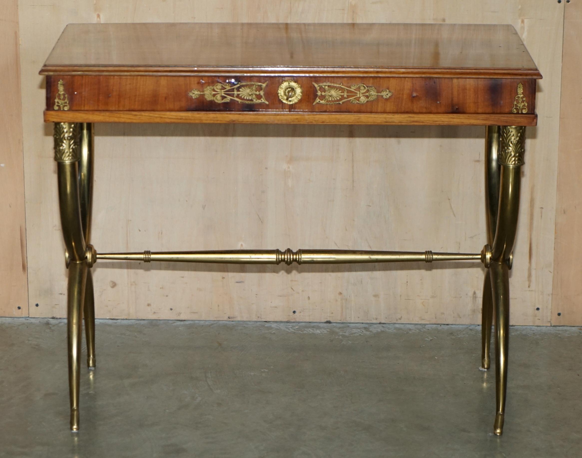 Royal House Antiques

Royal House Antiques is delighted to offer for sale this absolutely stunning, Regency Neoclassical style Walnut & Satinwood writing table with X framed solid brass base and hidden internal storage 

Please note the delivery fee