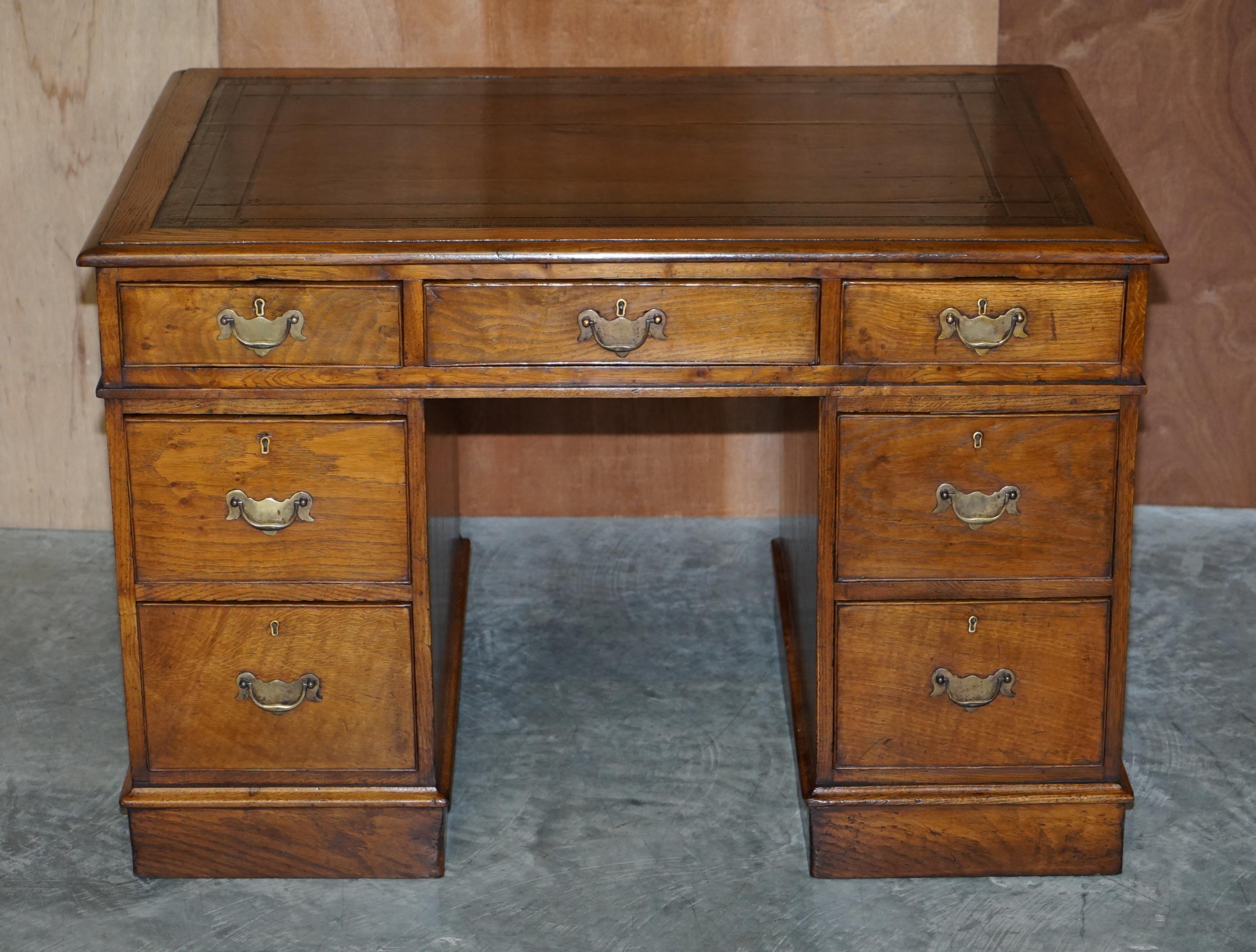 We are delighted to offer this stunning original and restored Georgian English pedestal desk in oak with a hand dyed brown leather writing surface, circa 1800

A very well made and traditional English partners pedestal desk. The timber is all oak
