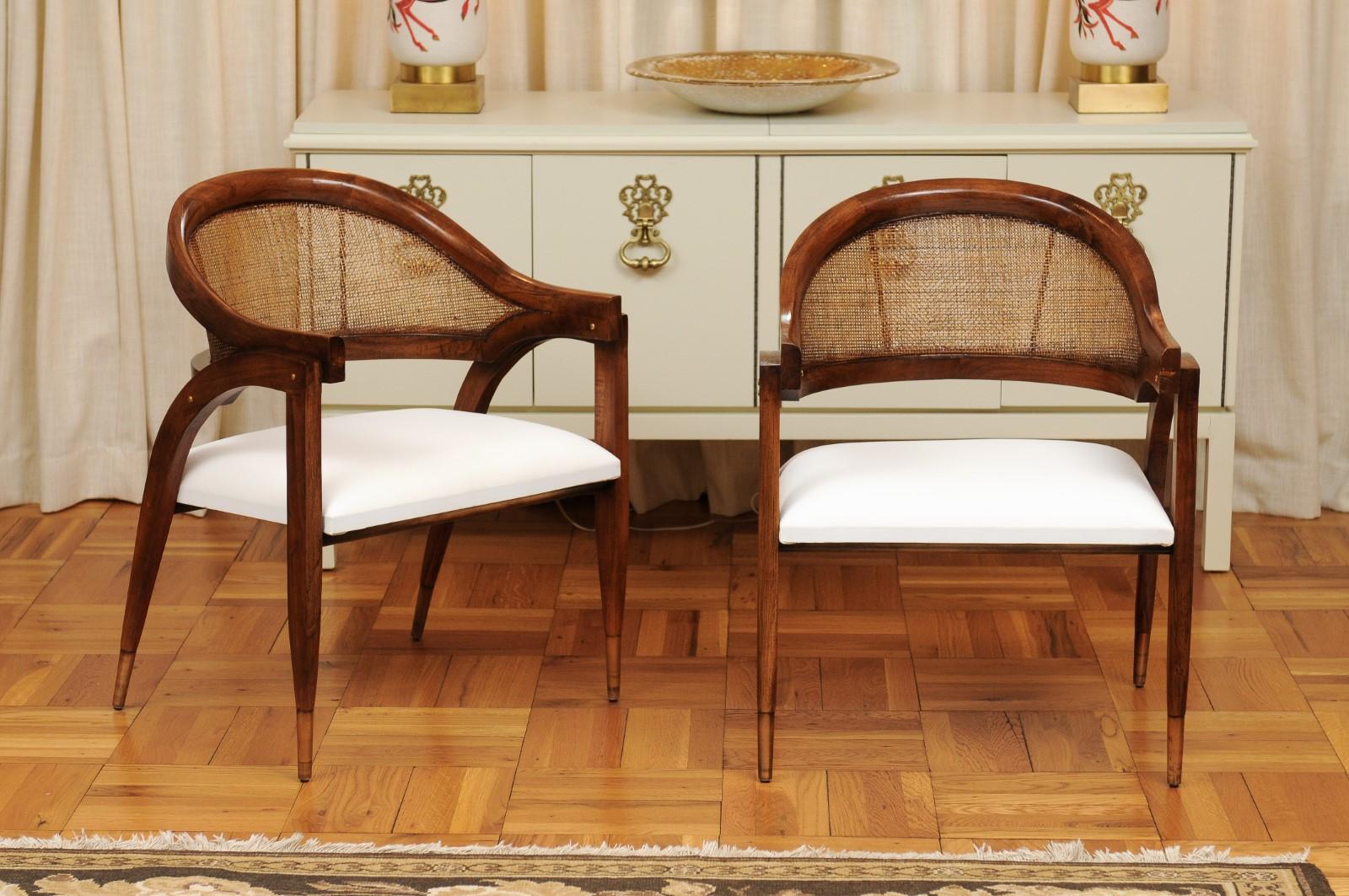 These magnificent chairs are shipped as professionally photographed and described in the listing narrative: Meticulously professionally restored and installation ready. Expert custom upholstery service is available.

A fabulous restored pair of