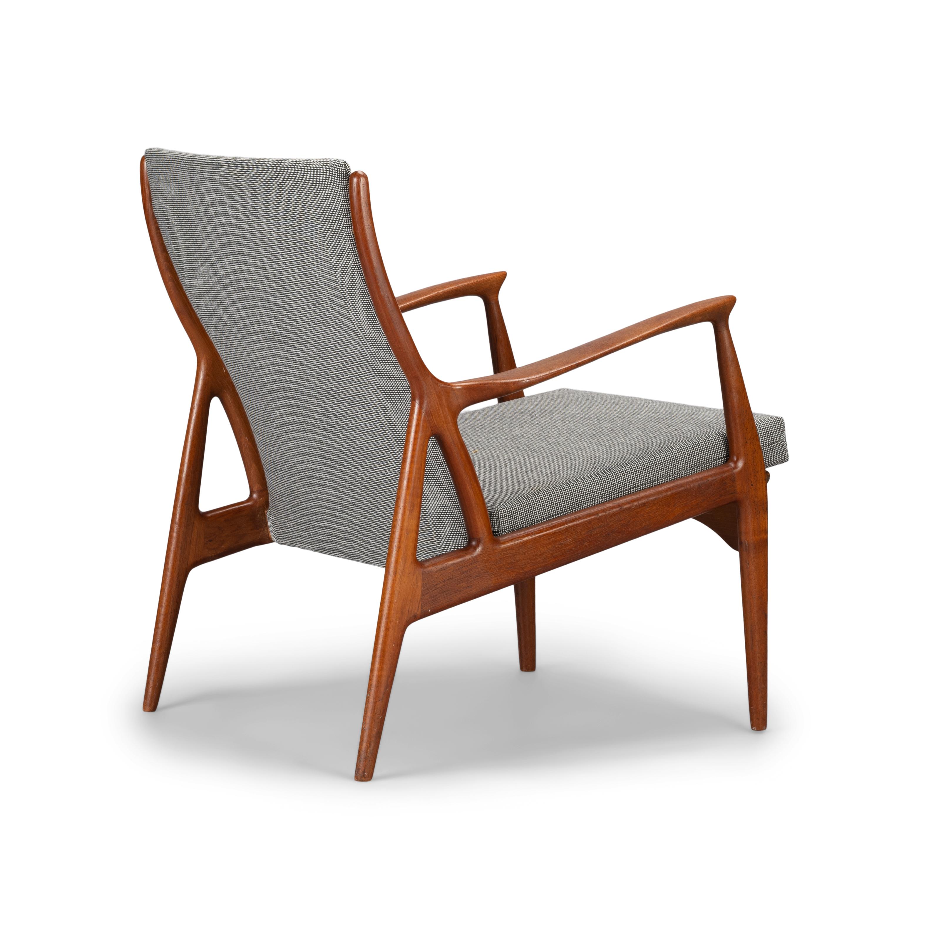 Danish design comes through in full force with this gorgeous lounge chair. Elegantly cut out of solid teak the organic yet calculated lines of the chair reveal the high design virtuosity of Andersen and Pedersen. A central triangular joinery section