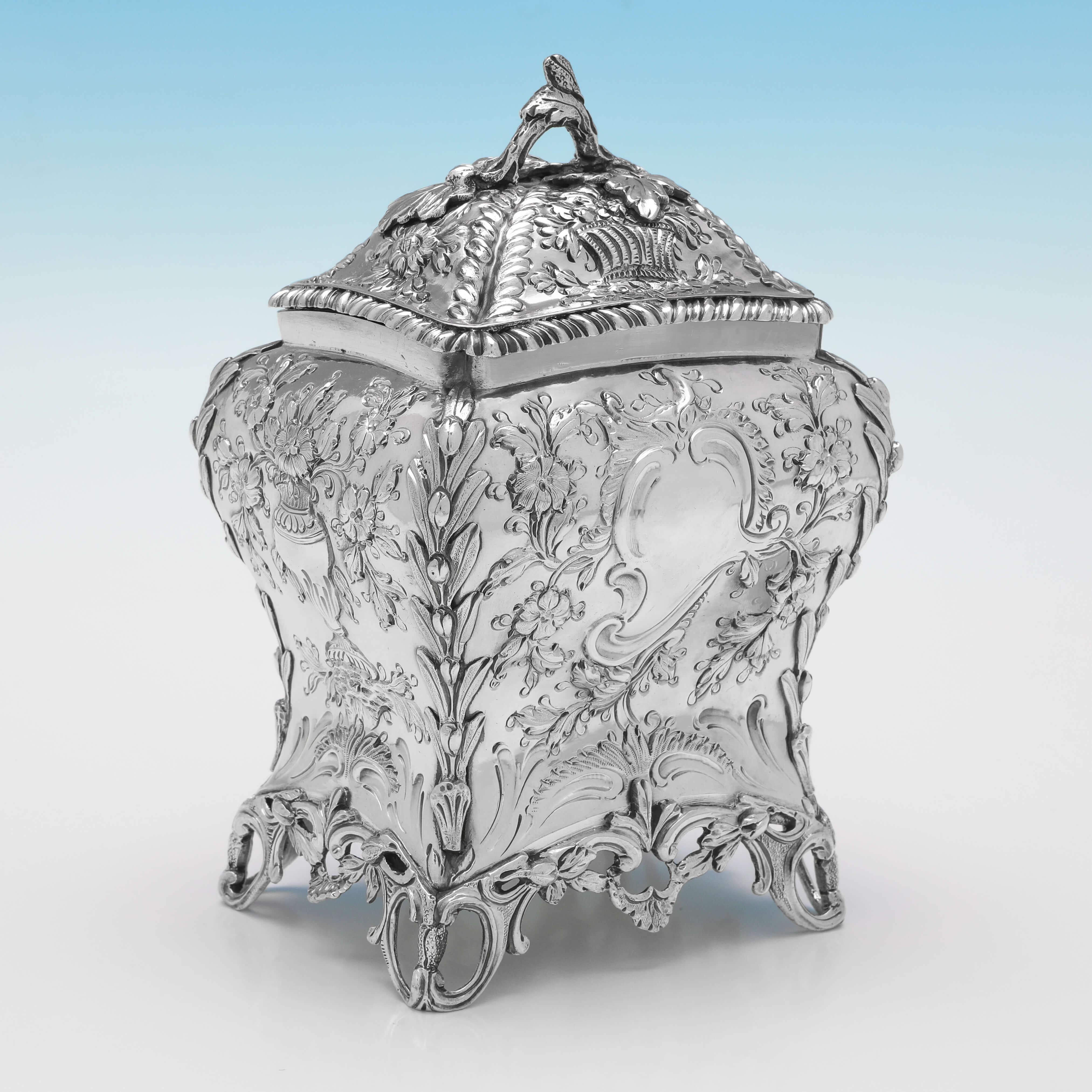 Hallmarked in London in 1768 by Henry Bailey, this stunning pair of George III period, Antique Sterling Silver Tea Caddies, feature Rococo chasing throughout, vacant cartouches, and removable lids. 

Each tea caddy measures 6