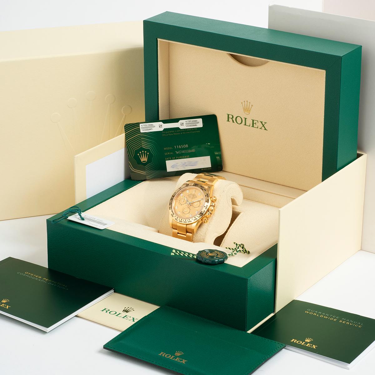 Our stunning Rolex Daytona reference 116508 features a 18k yellow gold case and bracelet and has a factory champagne and diamond dial. This highly sought after reference is a complete set, comprising inner and outer box with sleeve, swing tag x 2