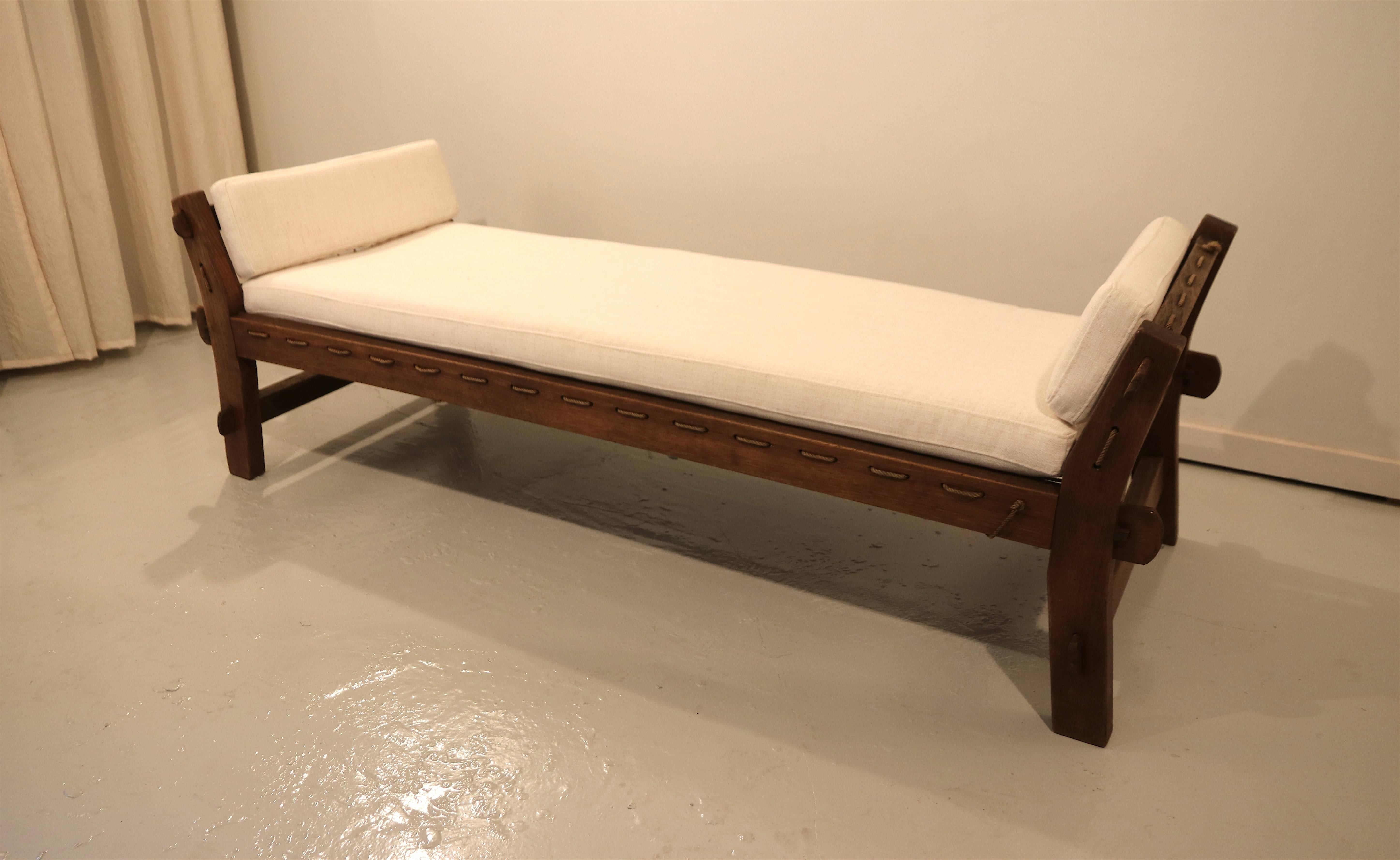 Beautiful oak daybed in the style of Charlotte Perriand, Jean Prouve and Pierre Jeanneret for Chandigarh, India. The piece has a solid wood frame with beautiful joints all around, no screws are used at all. The seat and sides are beautifully laced
