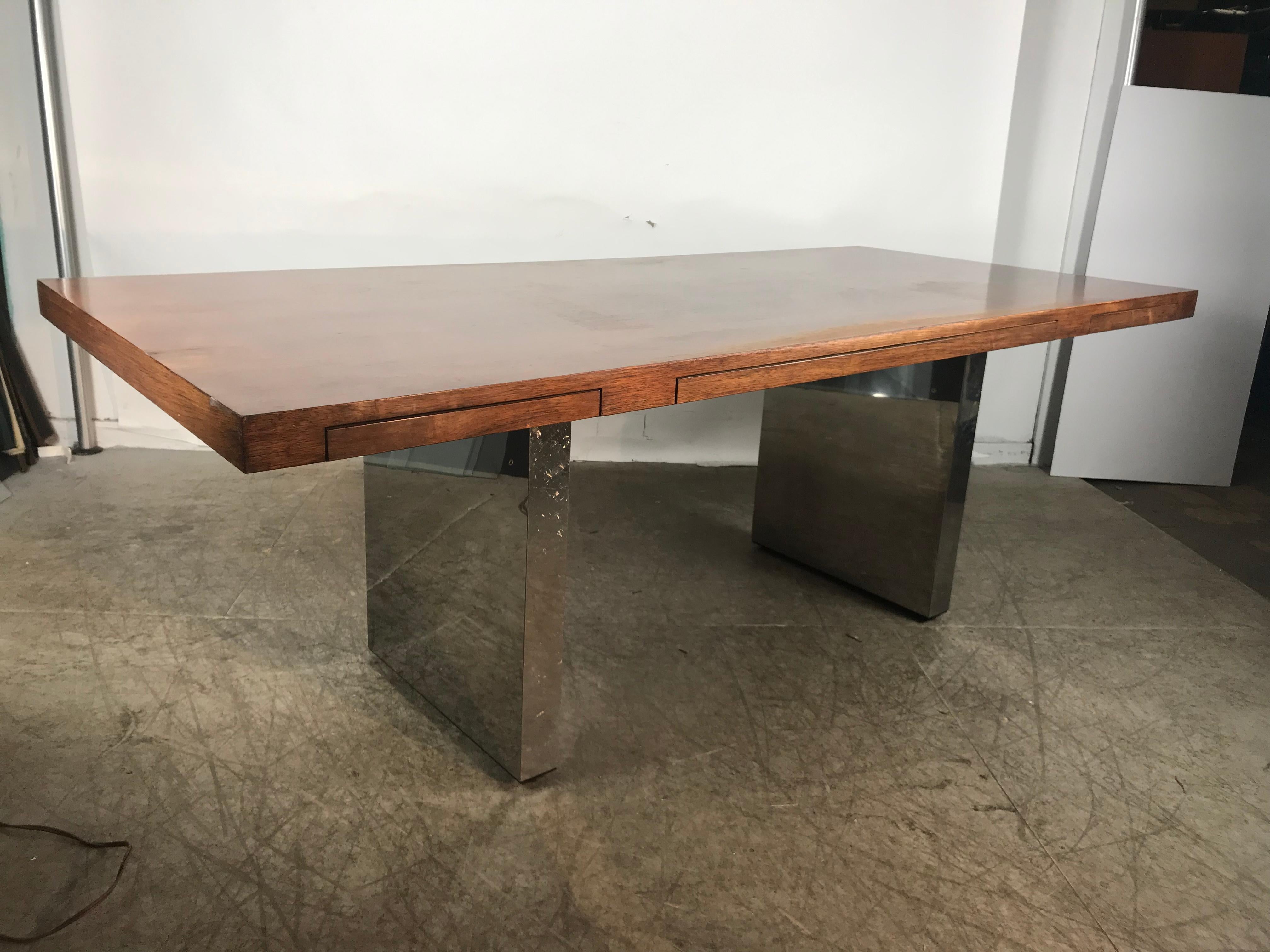 Classic 1970s executive desk,, Nice rosewood veneer and polished chrome base,, Three drawers across the top, retains original large 