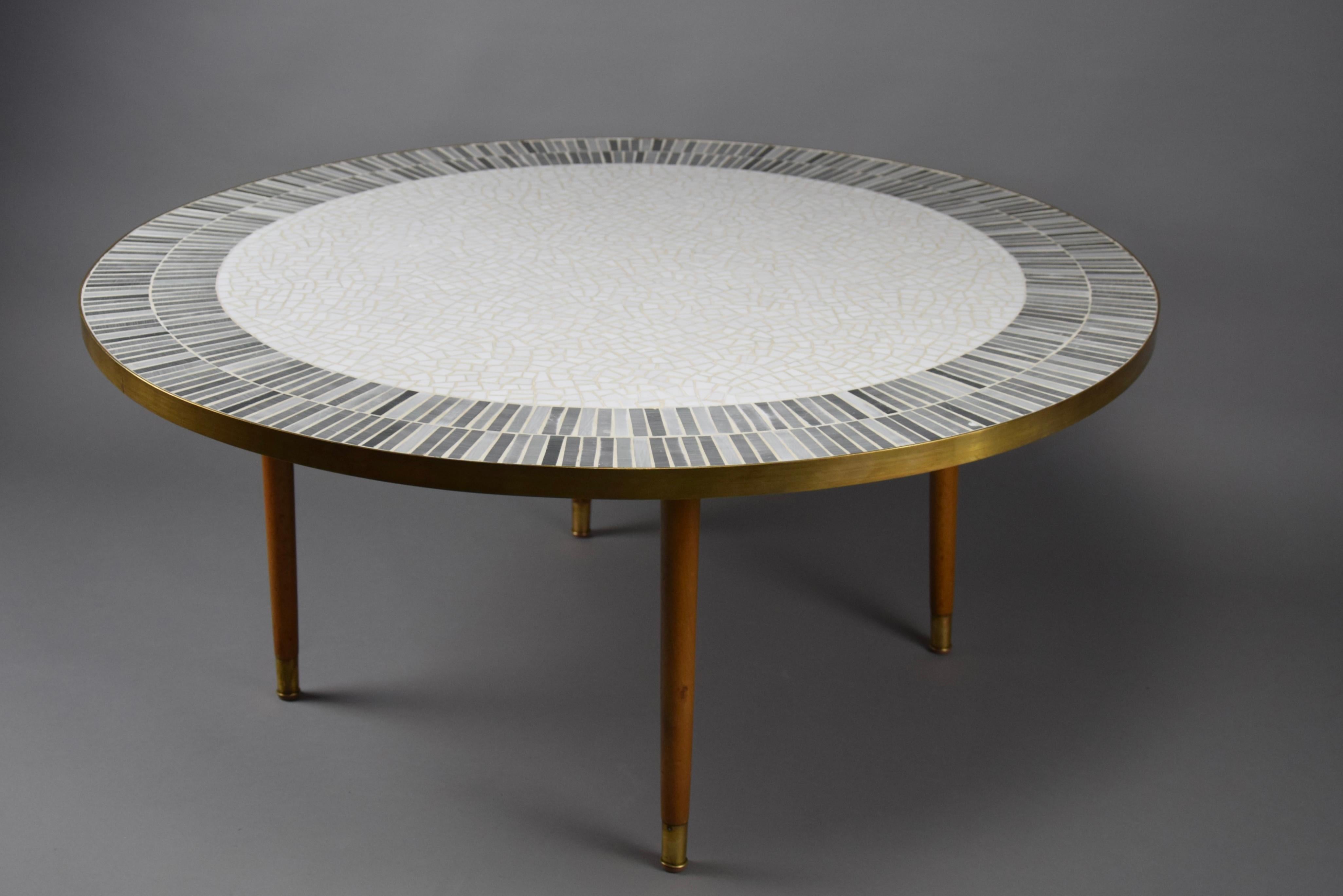 Introducing the epitome of sophistication: the exquisite round grey and white mosaic coffee table, a masterpiece designed by the renowned German sculptor Berthold Muller in the 1960s. This coffee table isn't just furniture; it's a work of art that