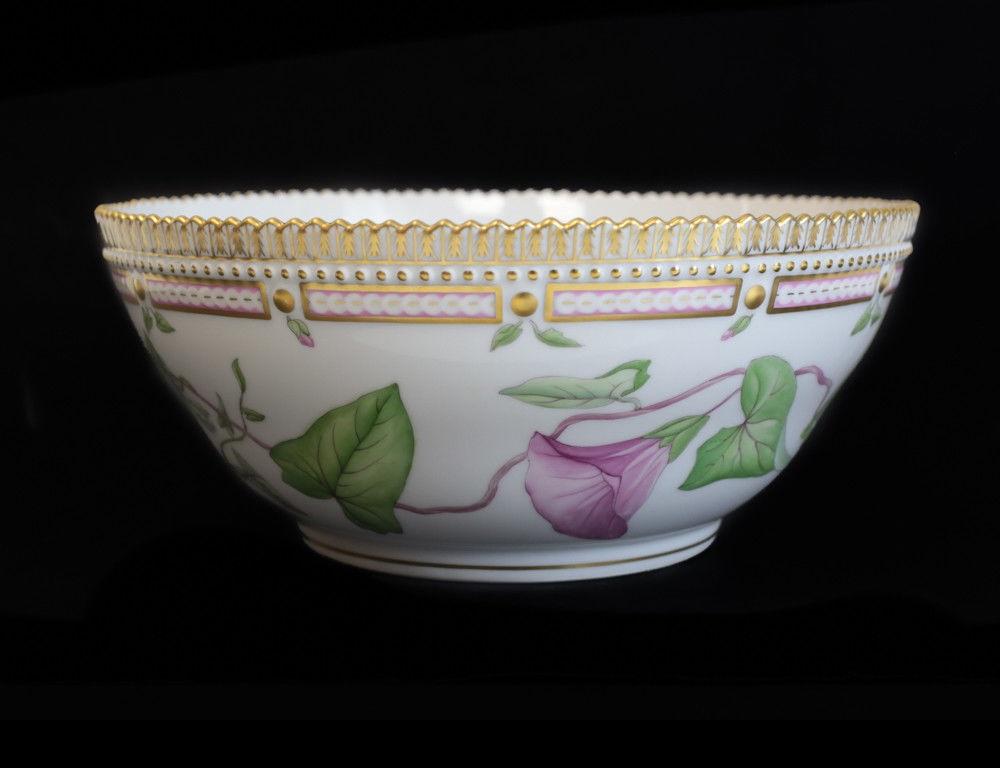 A stunning Royal Copenhagen hand-painted porcelain centrepiece bowl in Flora Danica. Beautiful hand-painted florals throughout with gilt accents. A jagged scalloped edge around the rim. Marked to the underside with the factory mark of 20/3555. The