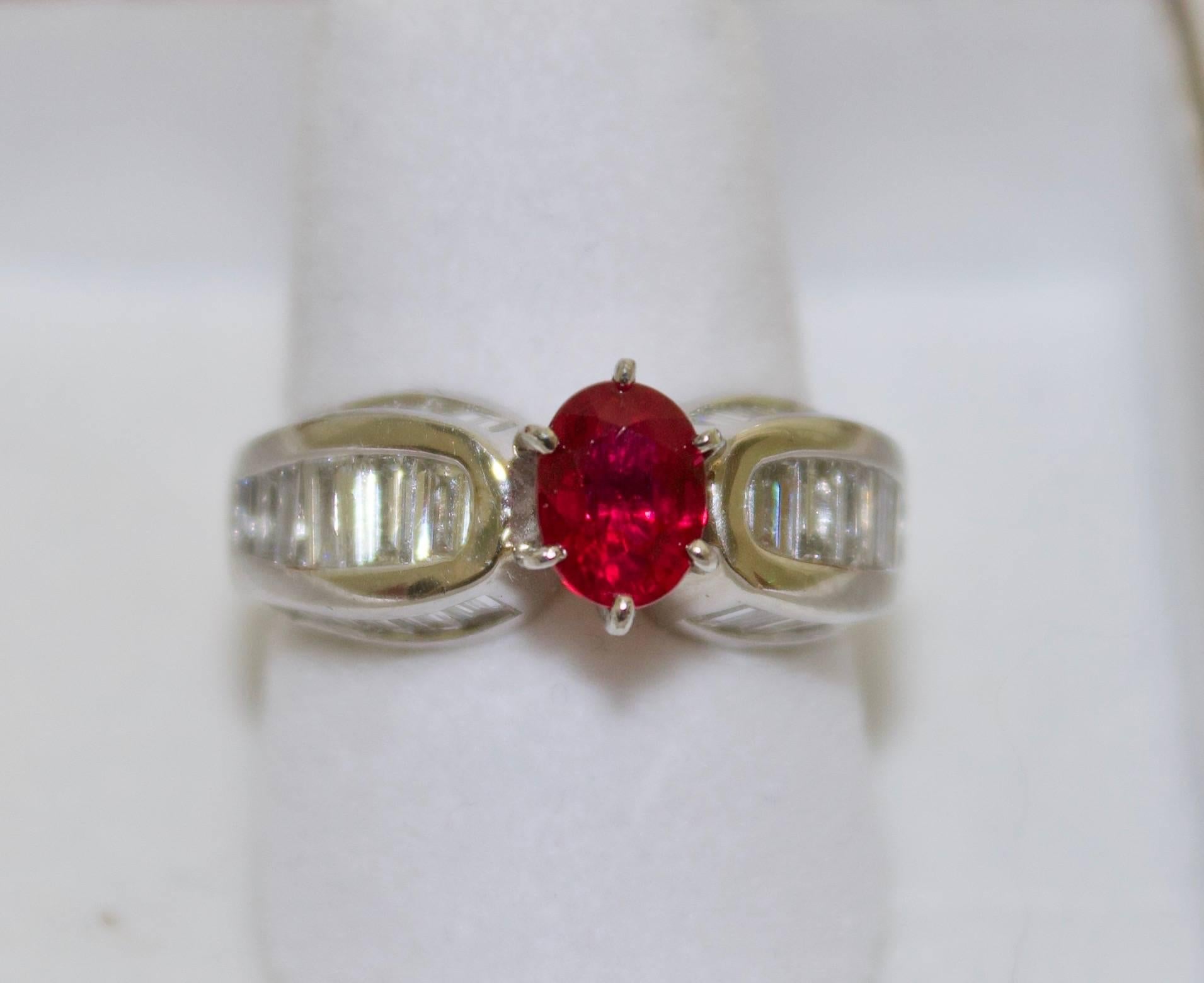 Stunning Ruby and Diamond Platinum Ring in Platinum
One Oval Ruby weighing 1.15 carats approximately Beautifully Red and Transparent (no visible imperfections to the naked eye or 10X magnification.
Tapered Baguette Cut Diamonds weighing 2.00 carats