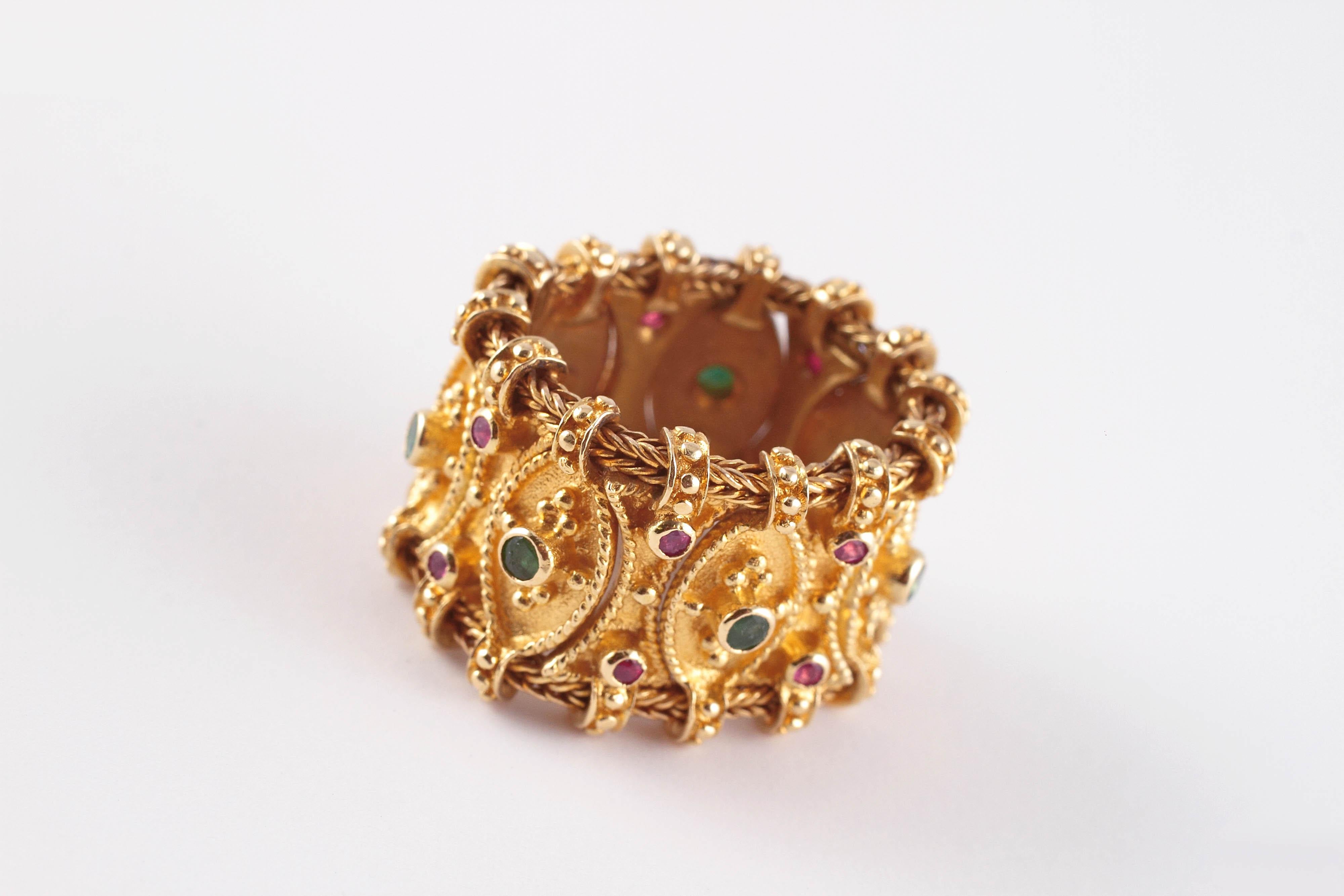 This is a stunner!  Composed of 18 karat yellow gold, with rubies and emeralds, comfortable and unusual!