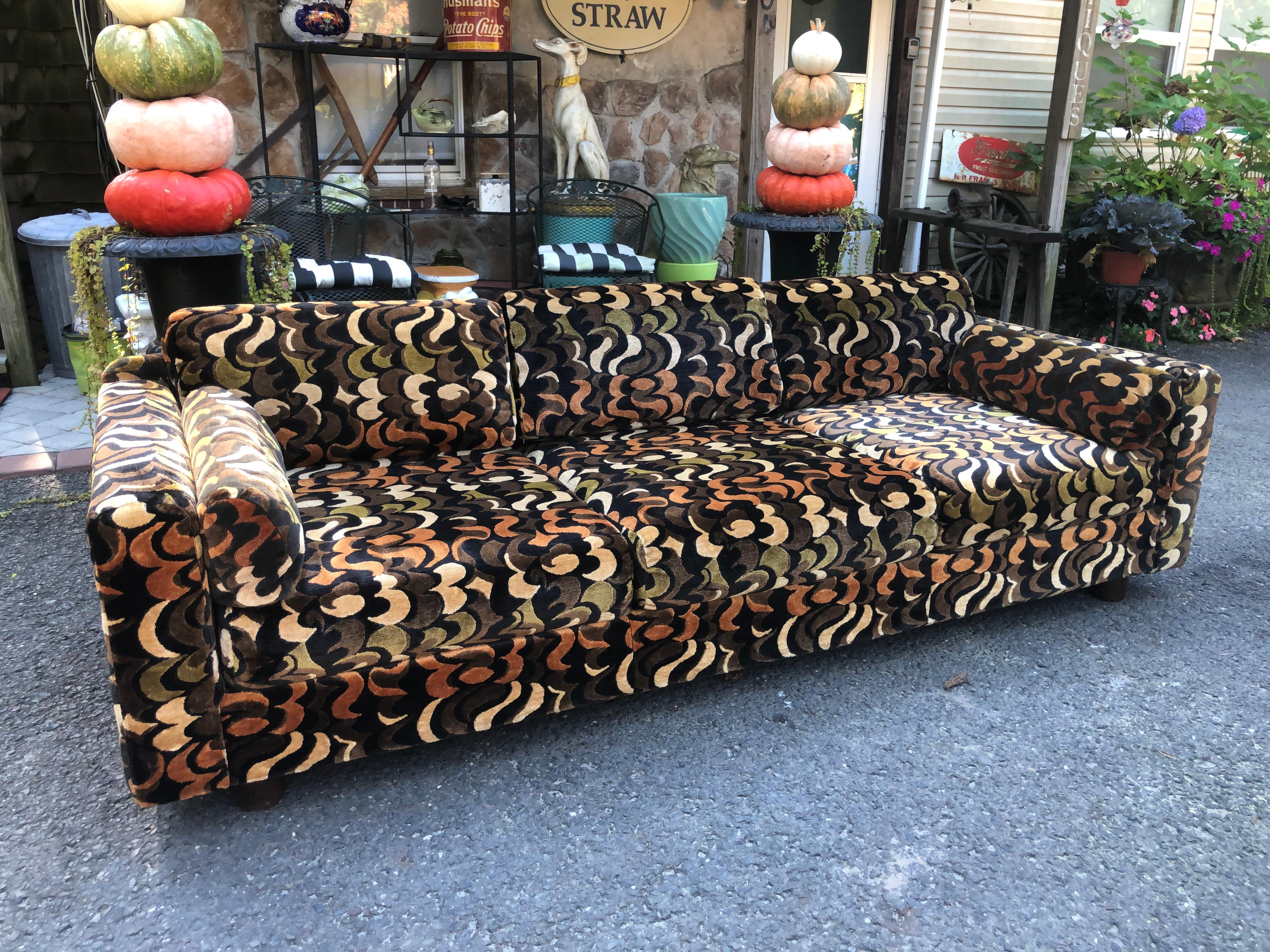 Glamorous Selig sofa with Jack Lenor Larsen style cut velvet fabric. The original fabric is in remarkable condition and is even more fabulous in person. This is a true vintage gem and a real treasure to be in this condition. It measures 27