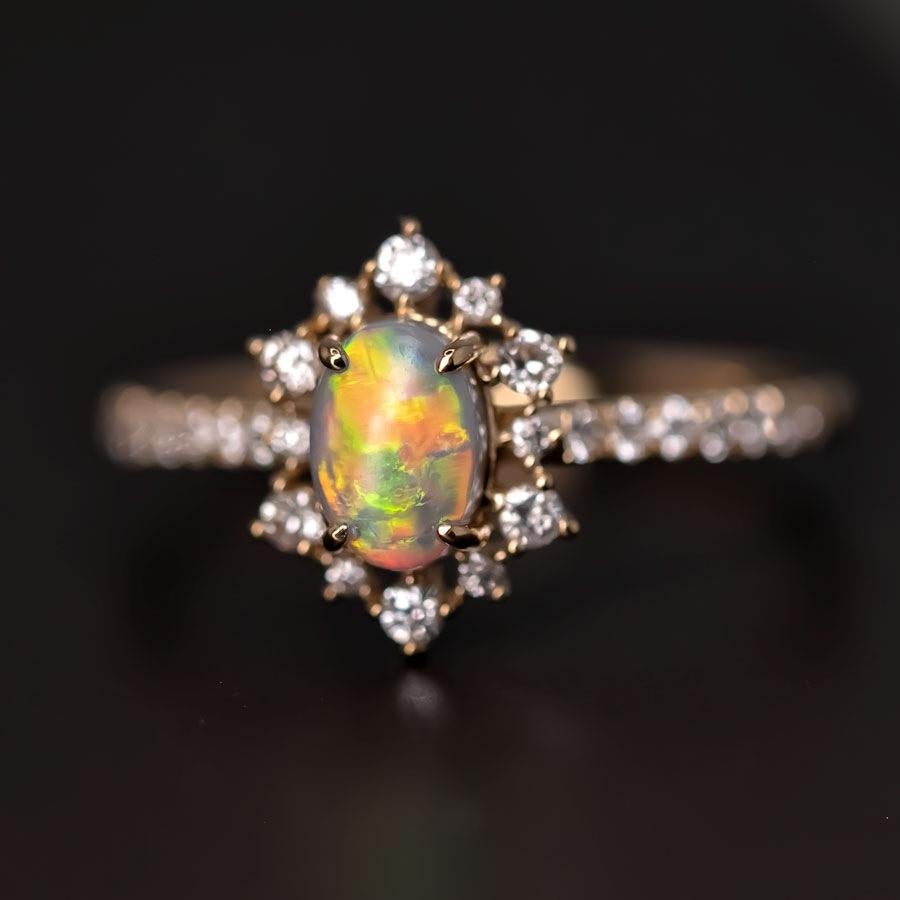 Stunning Australian Semi-Black Opal Diamond Engagement Ring 18K Yellow Gold.



This opal is absolutely stunning, but it does have some 