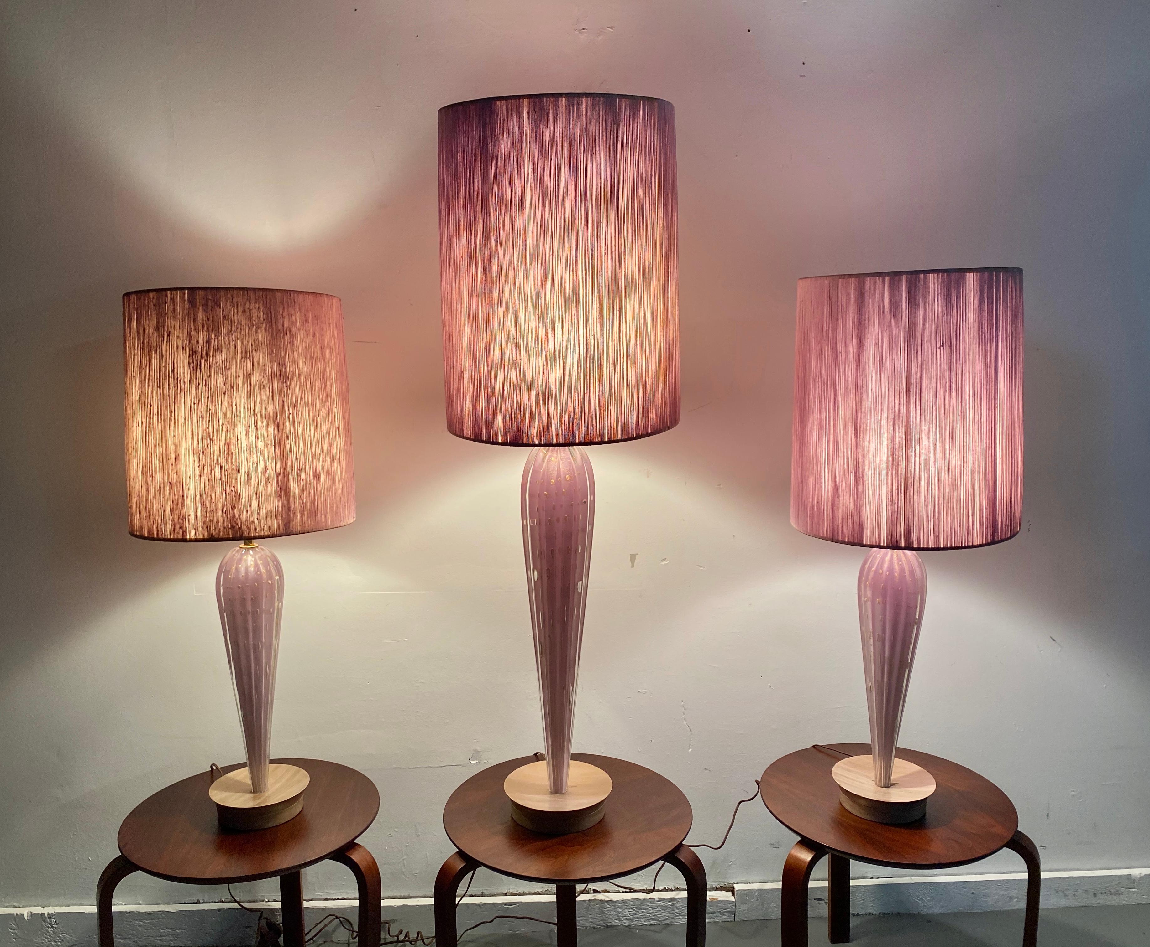 Stunning set 3 Modernist Murano lamps, by Seguso, Outragous lavender color, great modernist form, hand blown, controlled bubbles, retain original silk string lamp shades. Large center lamp measures 45