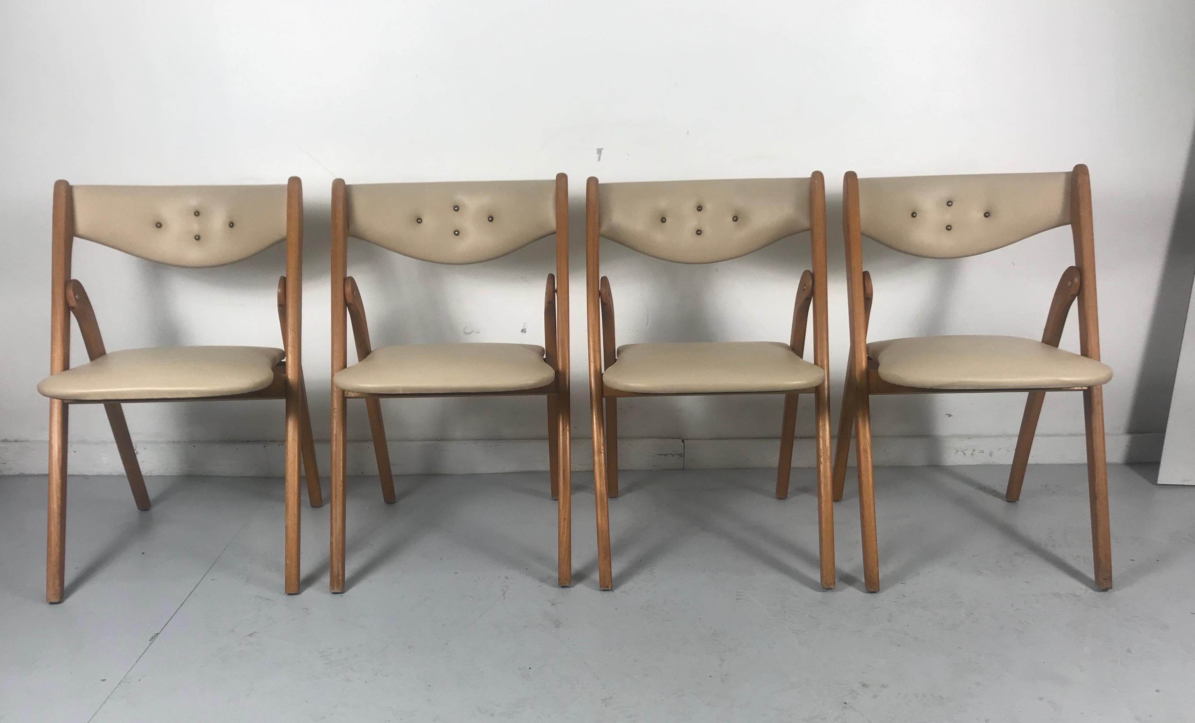 Stunning set 4 Mid-Century Modern folding chairs. (dining) Wonderfold by Coronet.. Amazing quality and design..coined.... You have to be told, they fold.. Retain they're original off white Naugahyde fabric upholstery. Button tufted backs. Nice brass