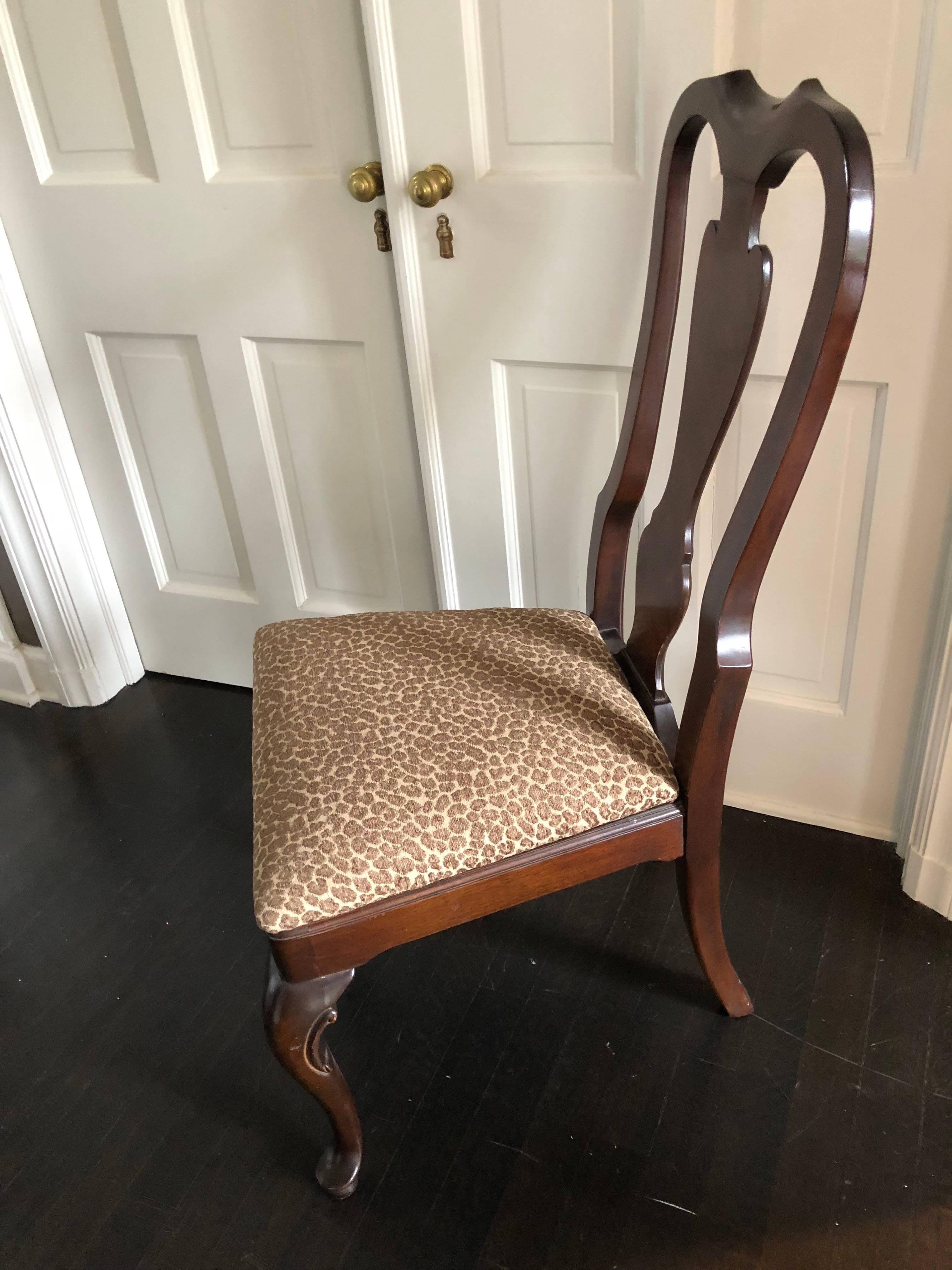 Beautiful set of ten Drexel heritage armless dining room chairs in the Queen Anne style. Chairs are solid mahogany and have been newly upholstered in a designer animal print
cotton. The seat height of each chair is 18