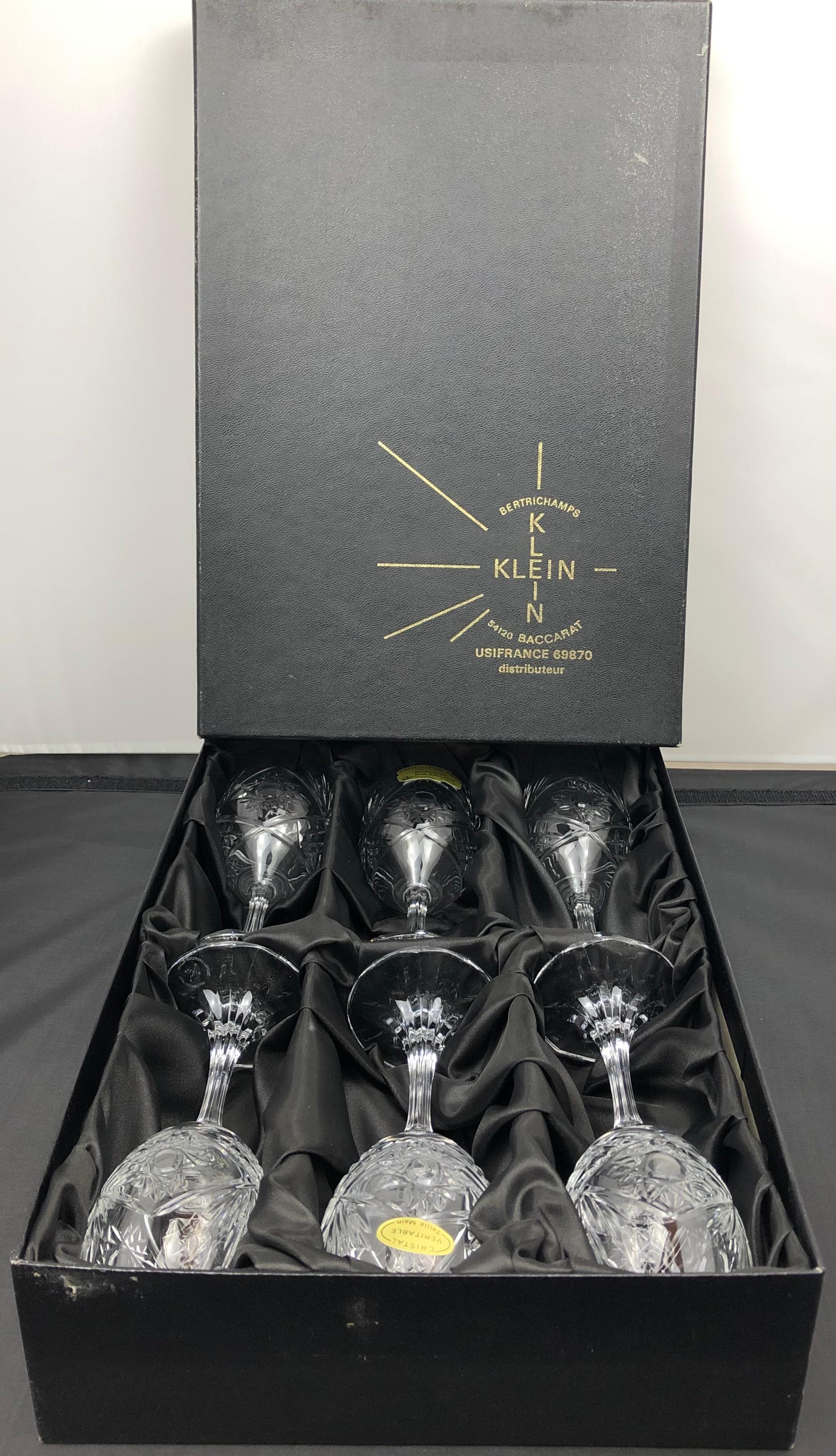 A truly elegant vintage set of Baccarat crystal wine glasses. This set is comprised of six white wine glasses with finely hand-cut details.  
France, circa 1940. 

Each glass bears the Baccarat mark and references the name of the designer, Valery