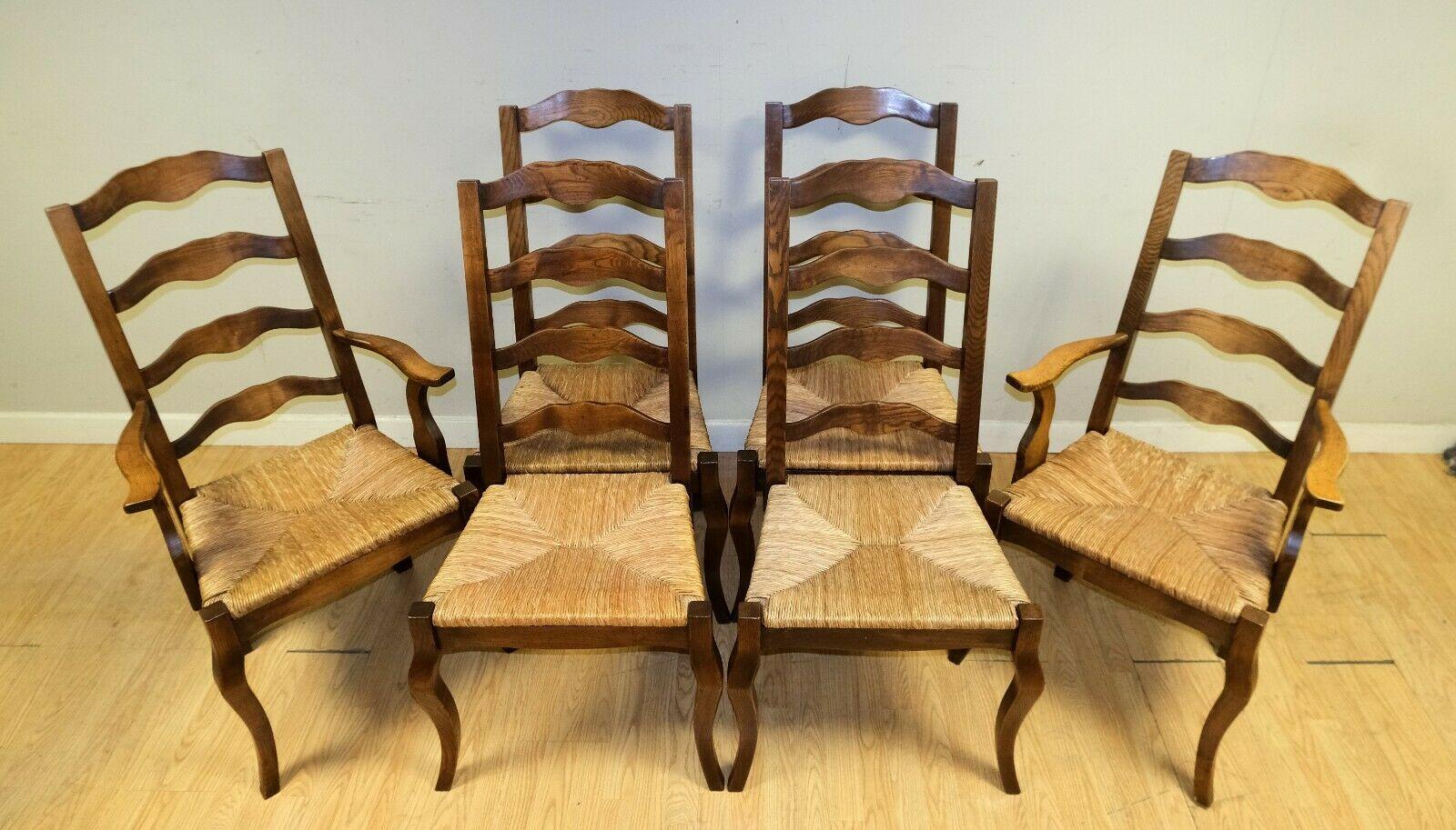 We are delighted to offer for sale these stunning set of six French, Elm wood, rush seat dining chairs with two carvers.

This lovely set is presented on elegant cabriole legs and ladder back. This set is just stunning, adding style to any dining
