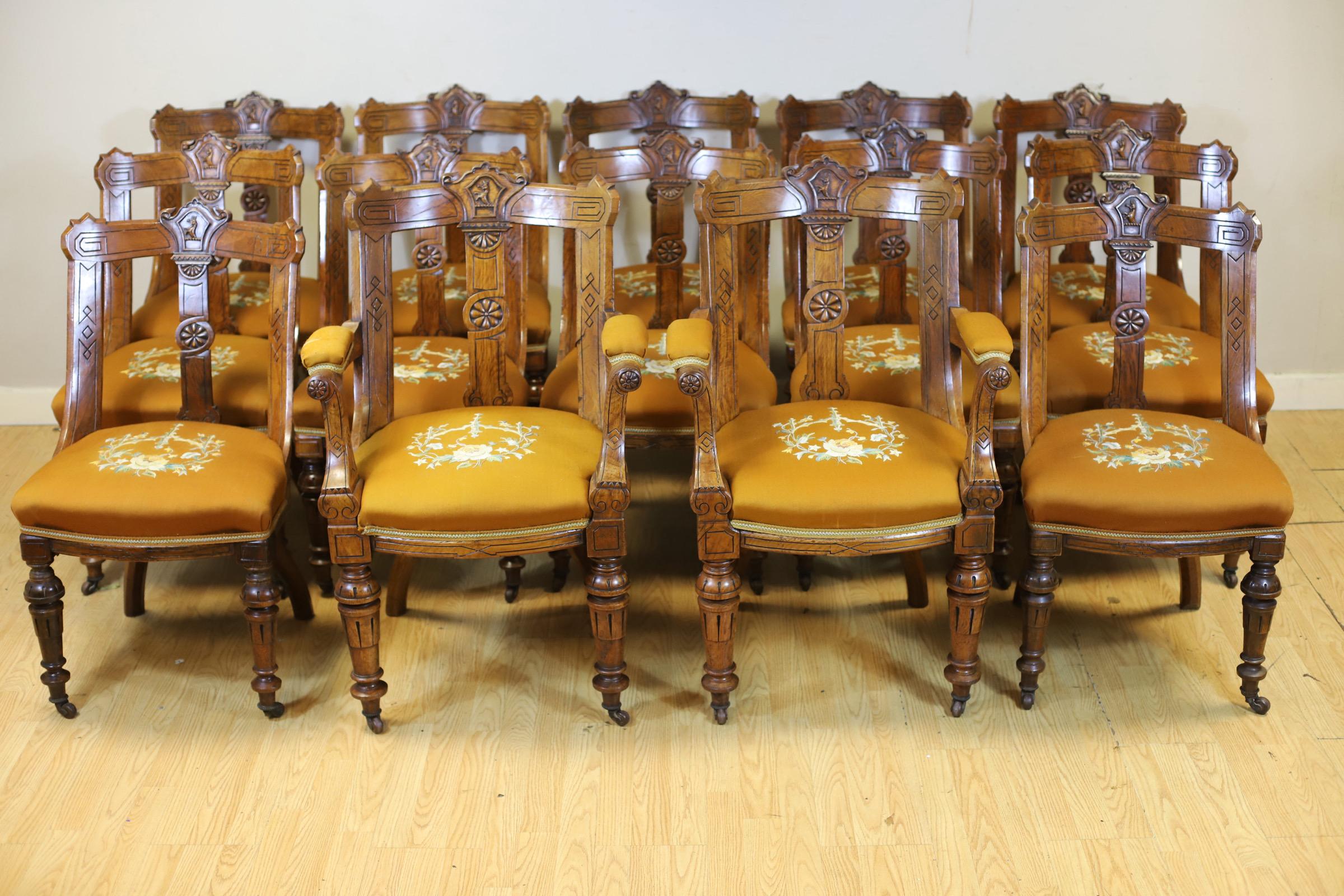We delight to offer for sale this stunning set of fourteen Victorian oak and pollard oak dining chairs, with relief moulded armorial centred back rails for the Withers family, over a vertical shaped and moulded splat, overstuffed embroidered seats