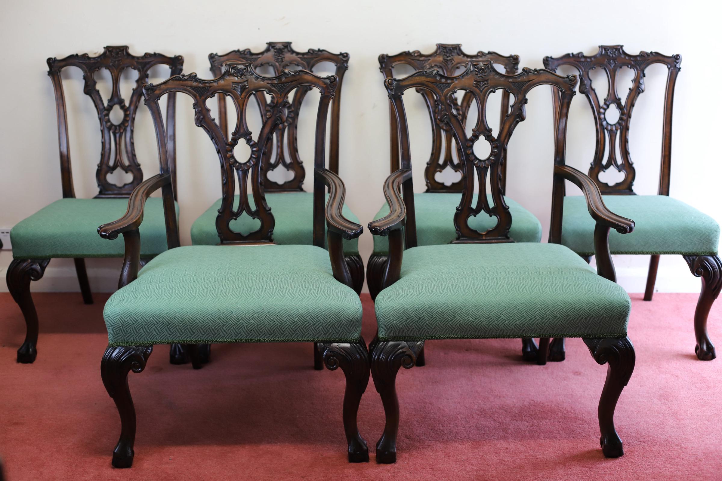 We delight to offer for sale this fantastic set of six carved mahogany and upholstered dining chairs in Chippendale style, late 19th century and later reupholstered; the openwork backrests all with foliate and Rocaille work vase form splats; the