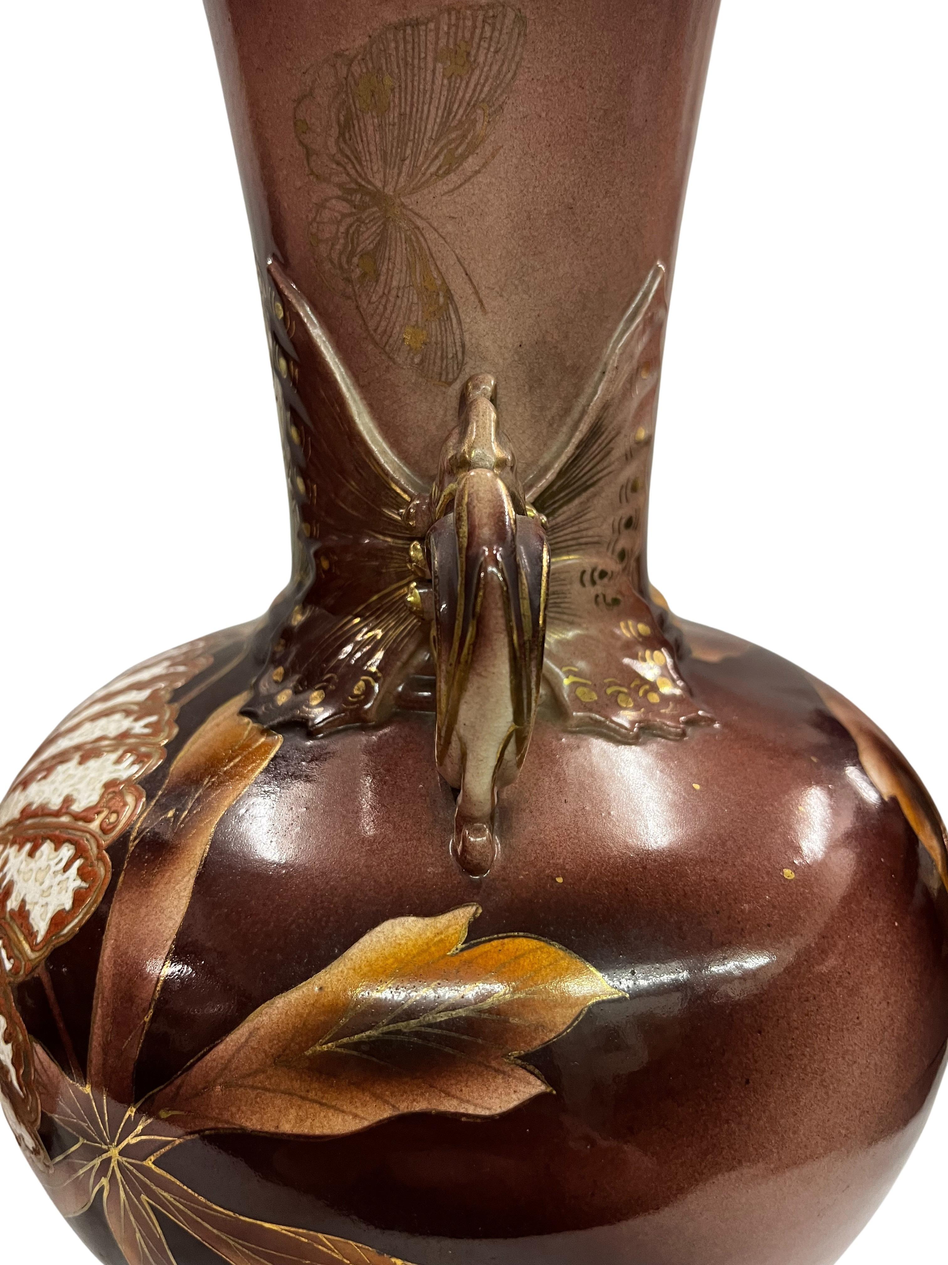very impressive set of two vases, made around 1900, in Japanese design and decoration, from France.

These two vases are impressive at first glance, but become increasingly interesting upon closer inspection. Many details are so delicate. 
The vases