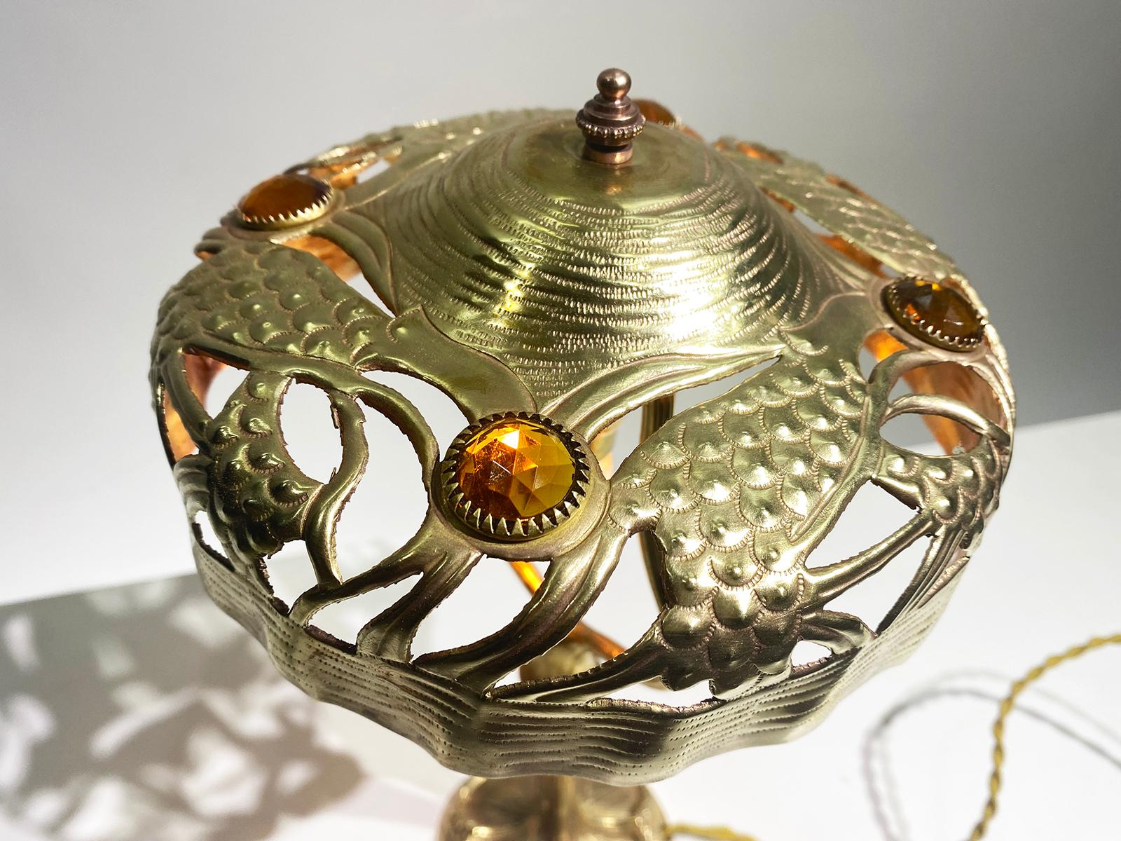 Beautiful and unique Art Nouveau table lamp, early 20th century, signed GEORGES LELEU (1883-1961),
Foot and lampshade in brass, decorated with stylized pine and orange stones, Circa 1910. 
Signed G. LELEU on the base of the foot.
Can be delivered